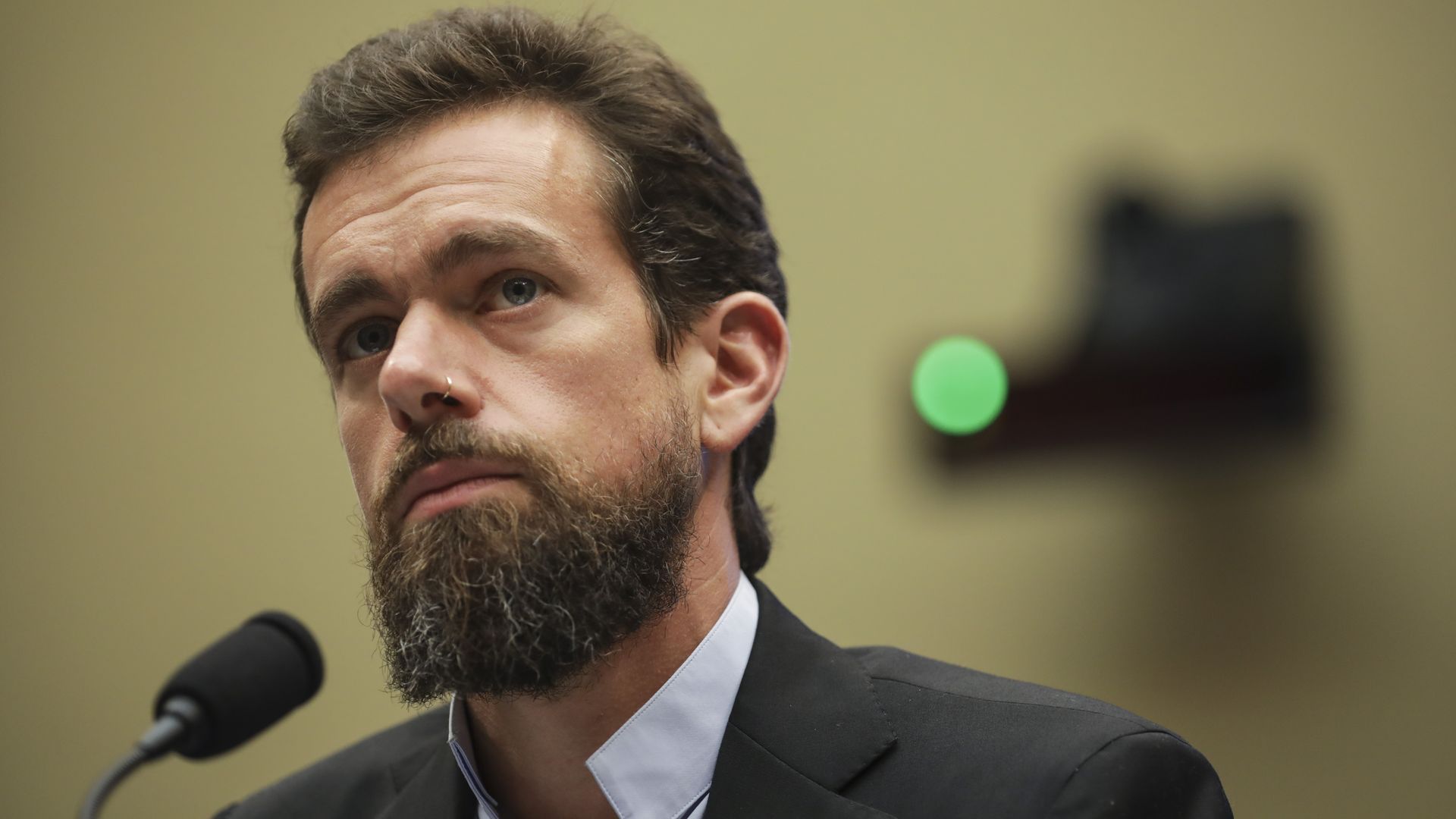 Photo of Jack Dorsey speaking into a microphone