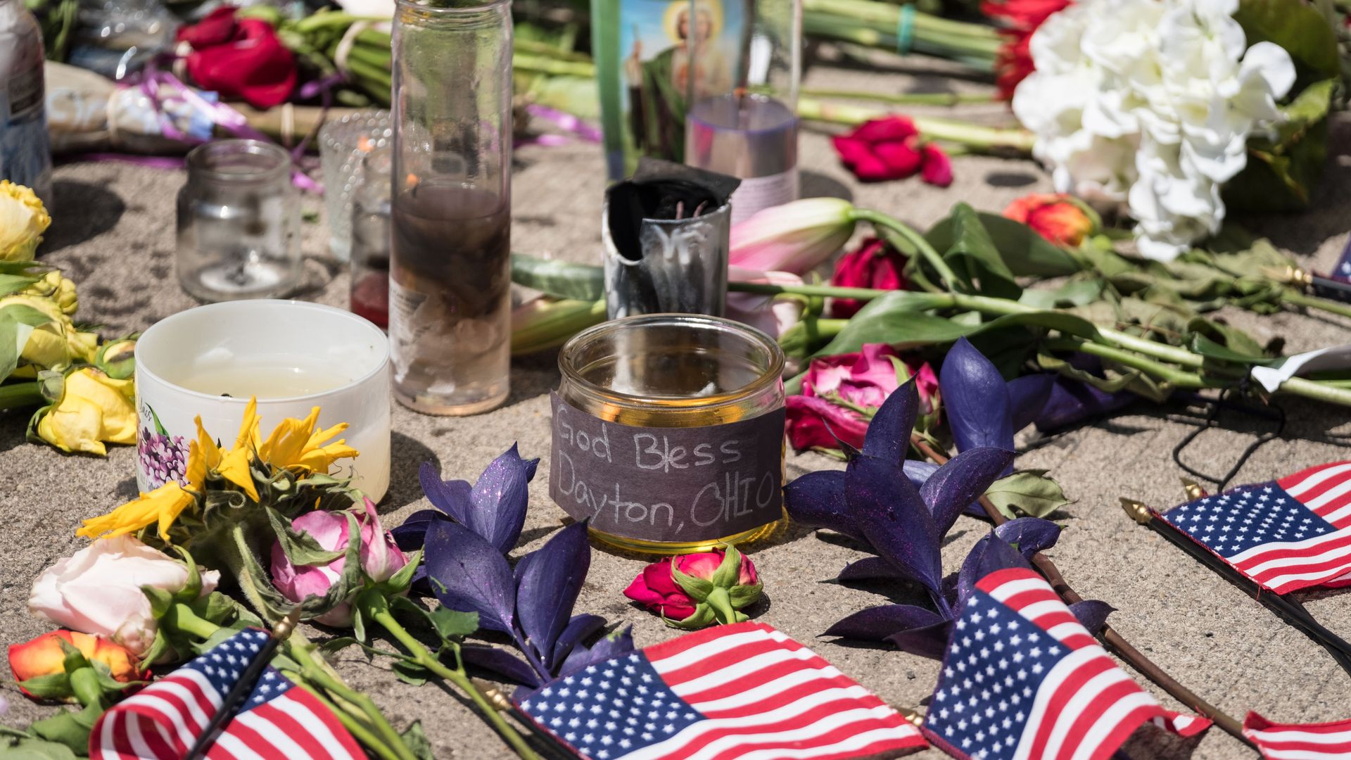Candles and flowers a placed in front of Ned Peppers bar after the mass shooting