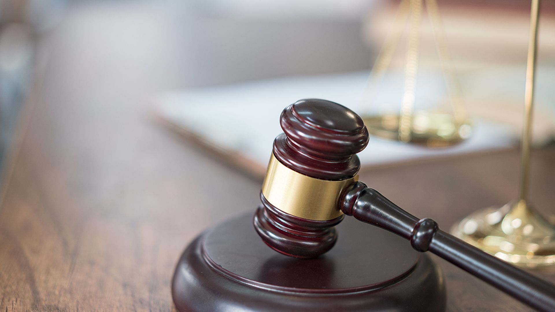 GettyImages, Justice Scales and books and wooden gavel