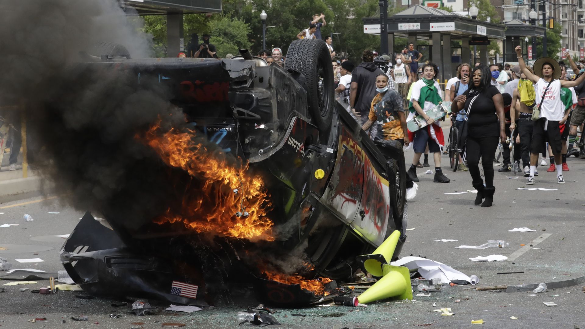 Picture of a police vehicle on fire in a protest in Salt Lake City