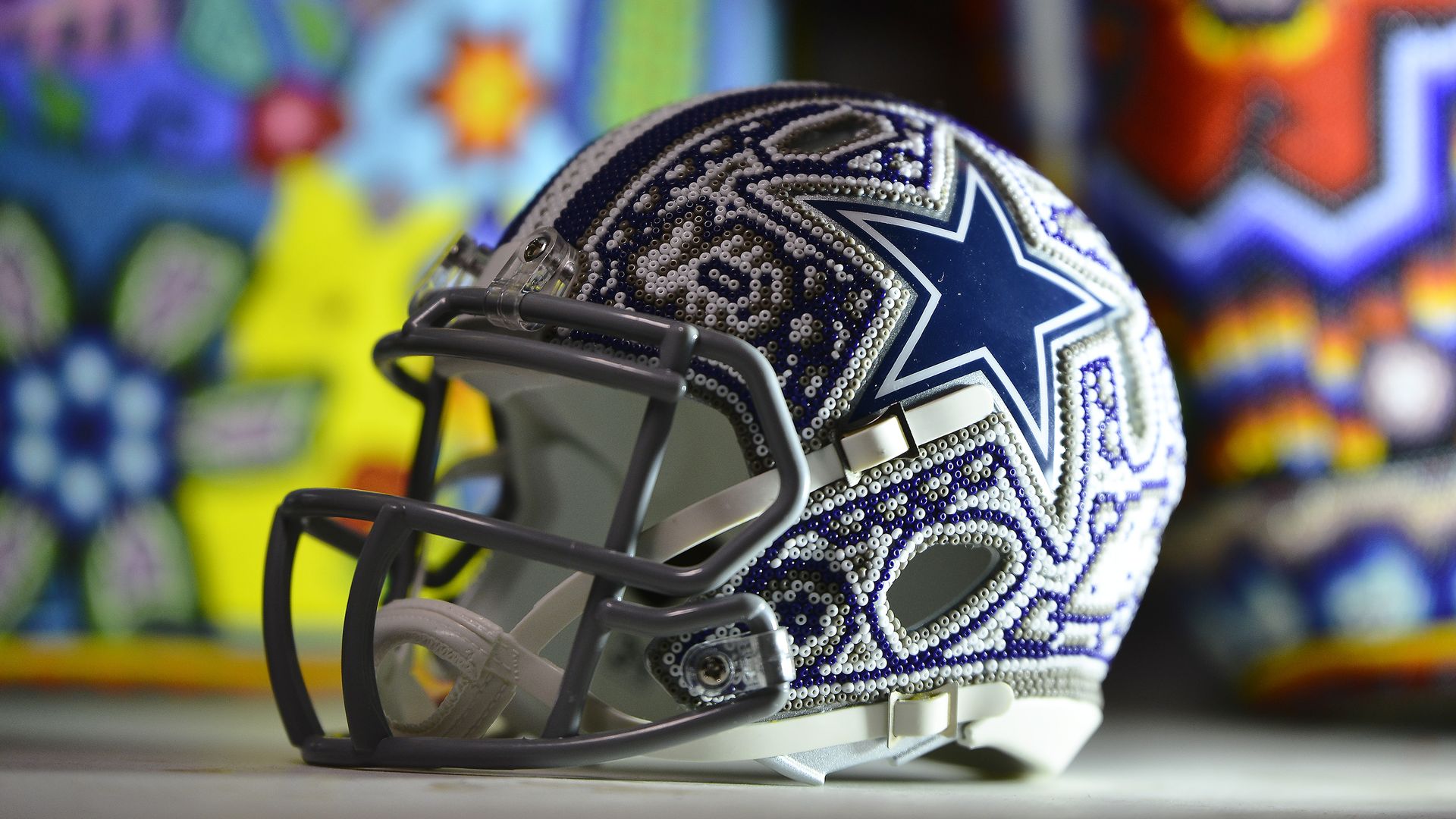 A Dallas Cowboy football team helmet made of Huichol handicraft 