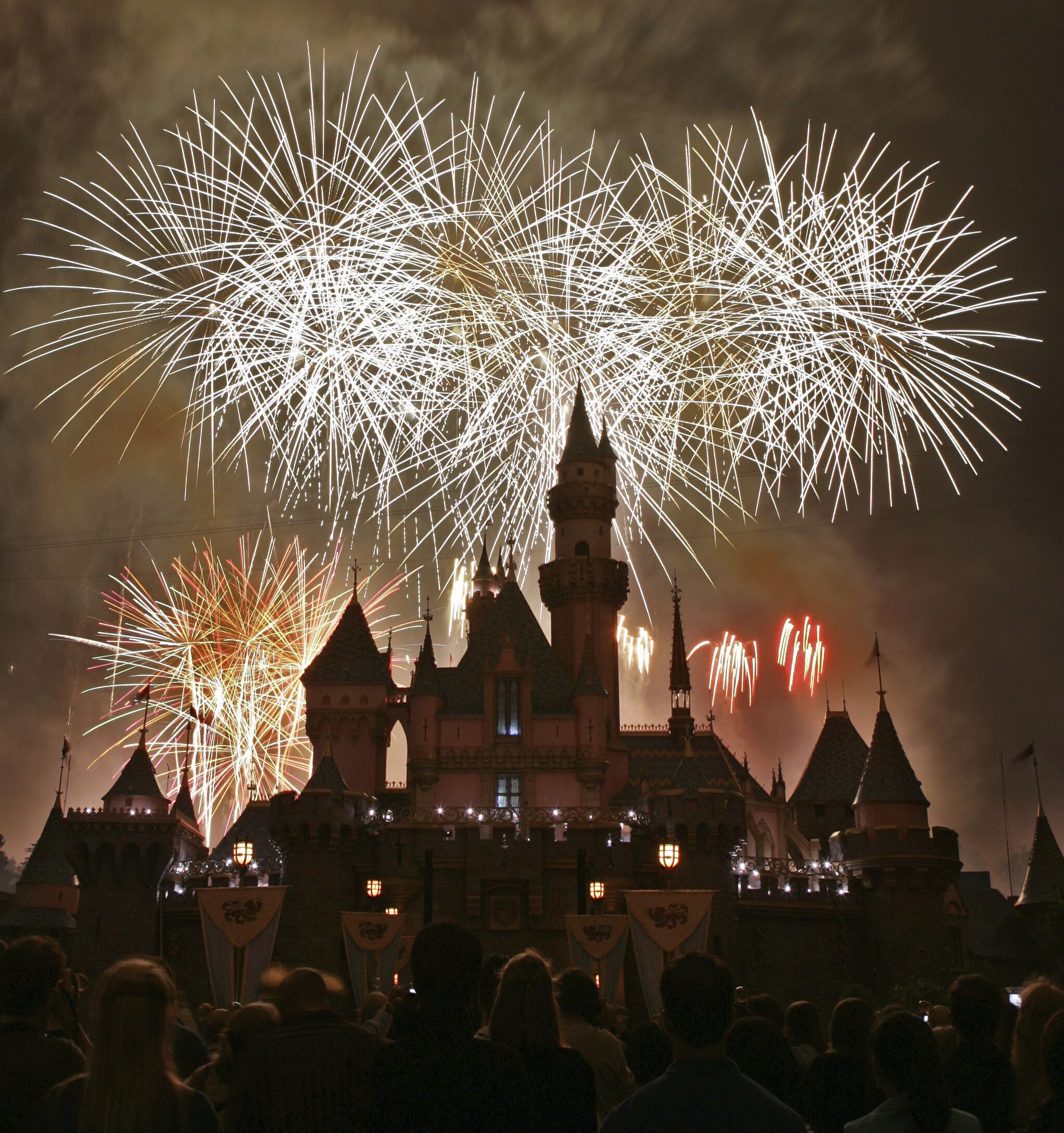 FILE - Fireworks explode behind Sleeping Beauty's Castle during Disneyland's 50th anniversary celebration in Anaheim, Calif., May 4, 2005. (AP Photo/Kevork Djansezian, File)