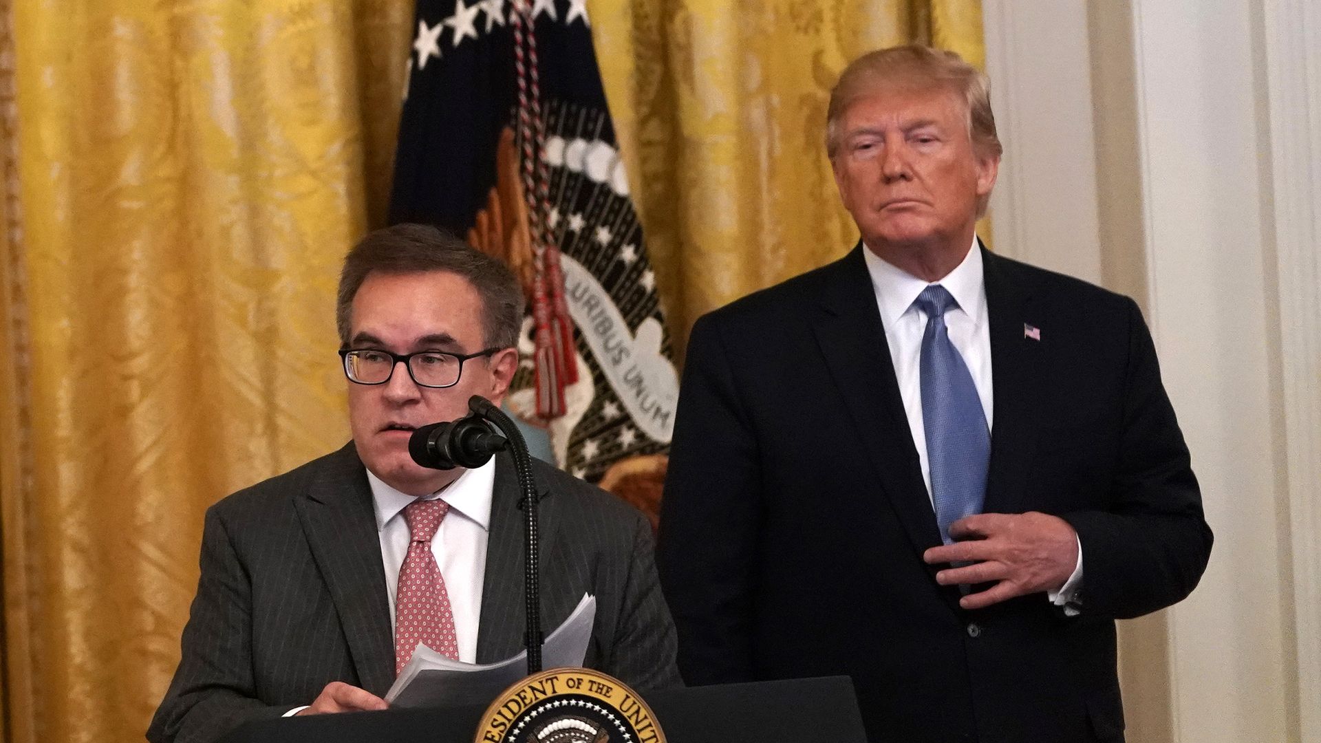 Environmental Protection Agency Administrator Andrew Wheeler (L) speaks as President Donald Trump (R) looks on during an East Room event on the environment July 7, 2019 at the White House 
