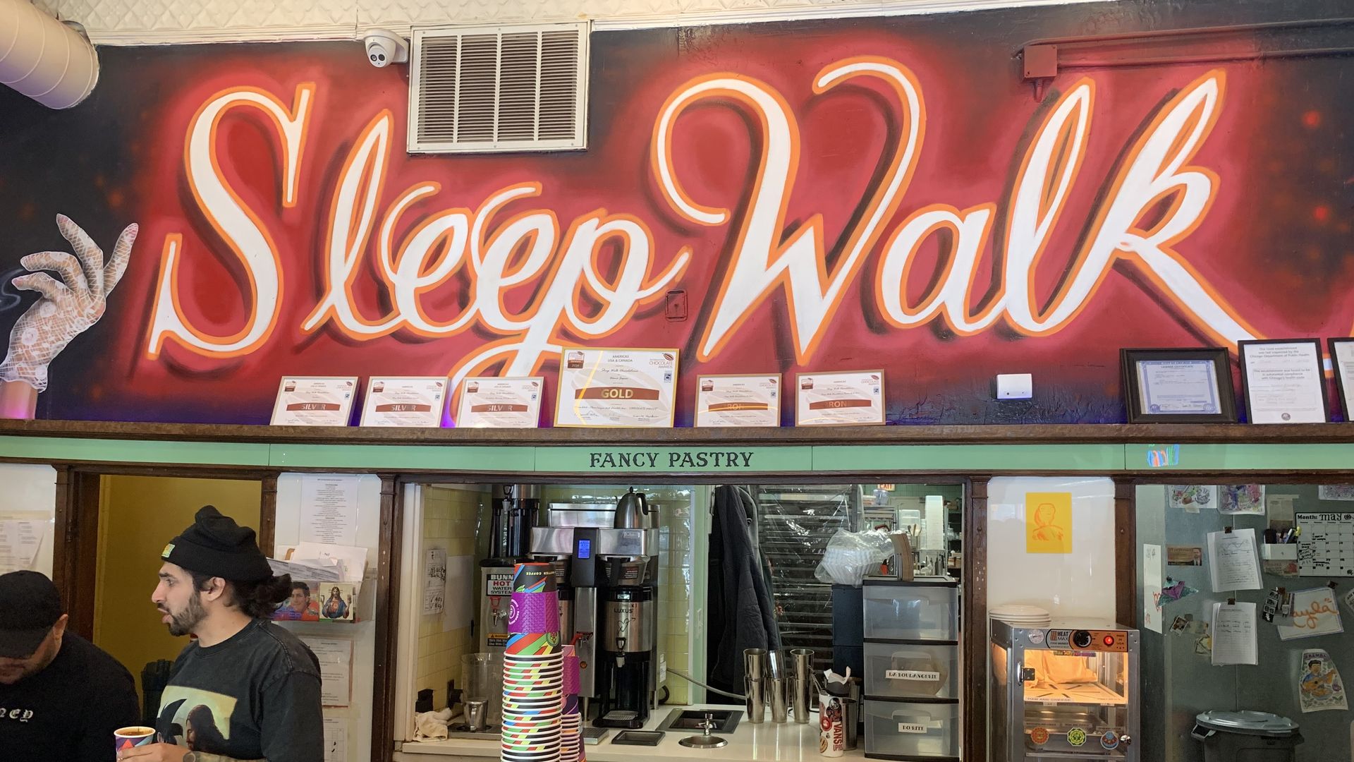 Photo of a sign that says "Sleep Walk" in cursive letters. 