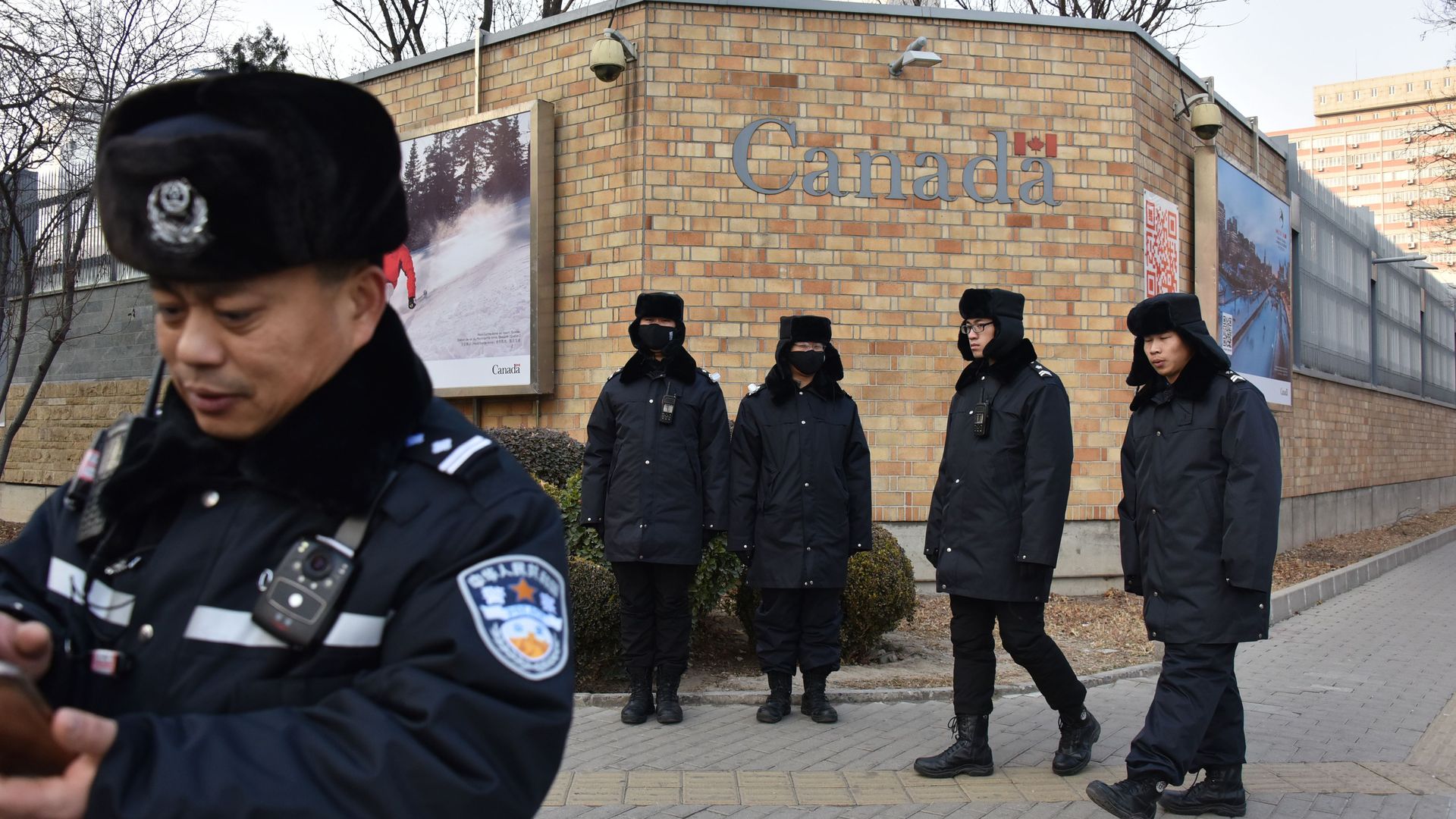 Chinese policemen guarding the outside of the Chinese embassy in Canada Dec. 10.