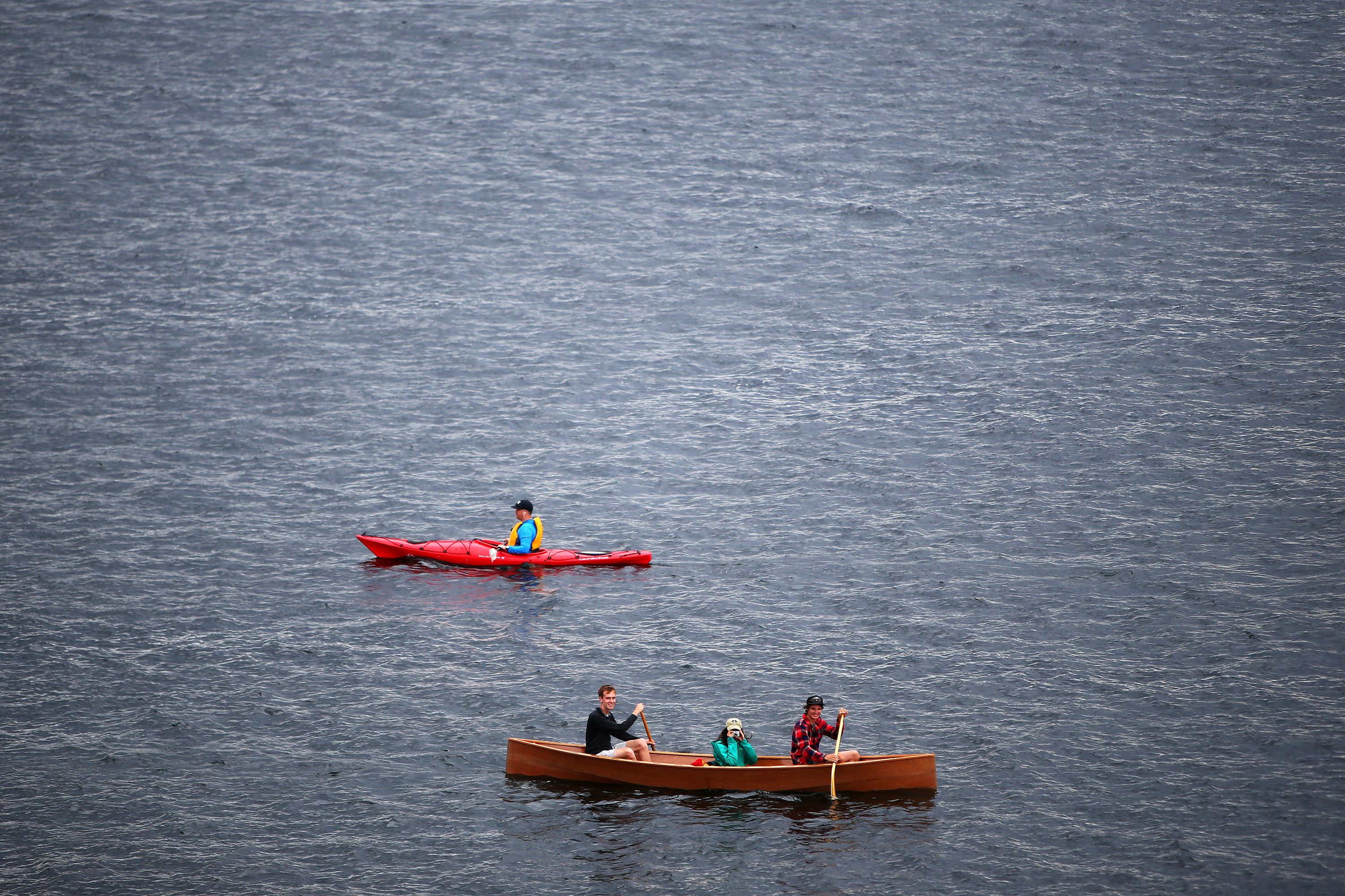 Kayaks and canoes float on Lake Union