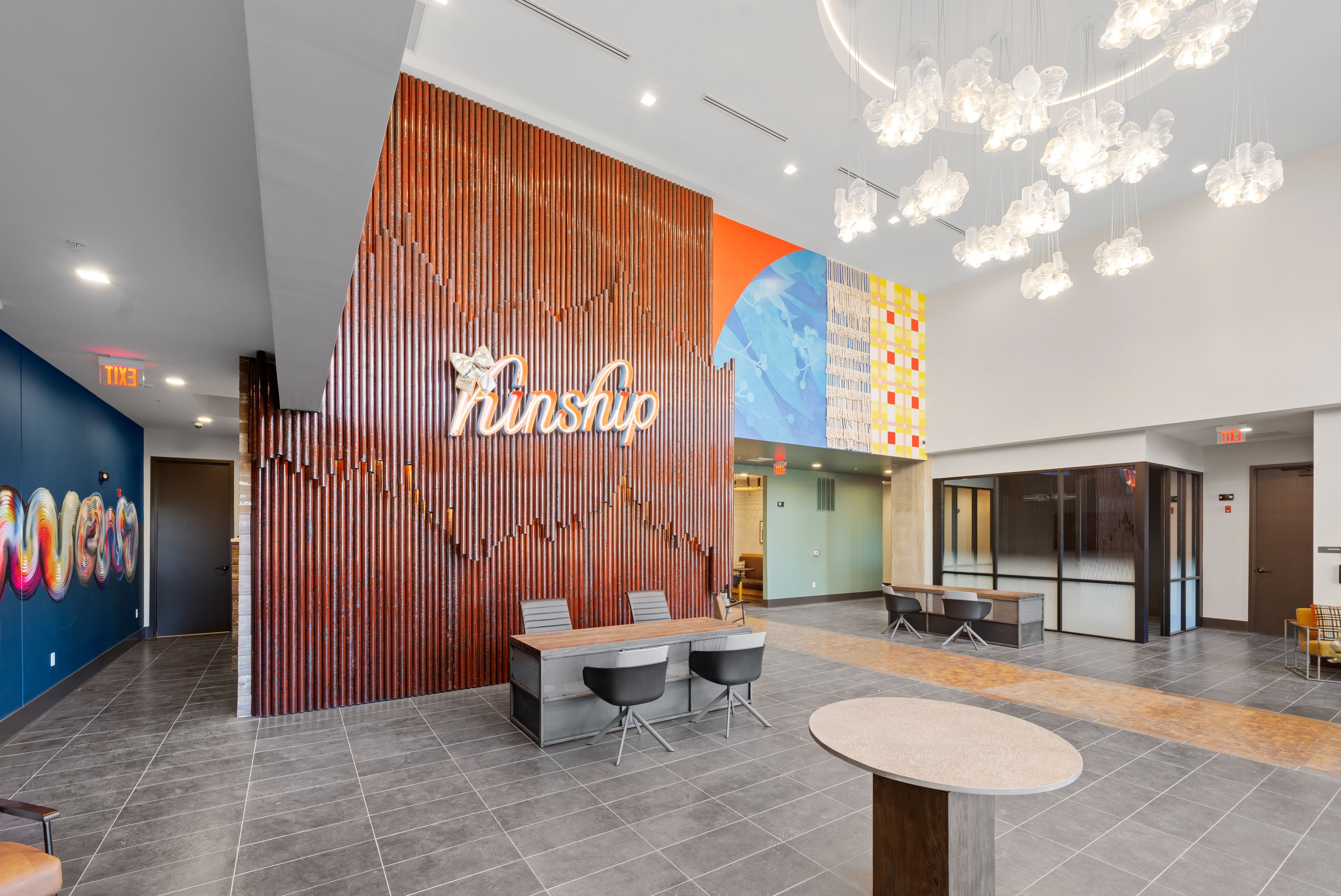 Apartment lobby with "Kinship" sign