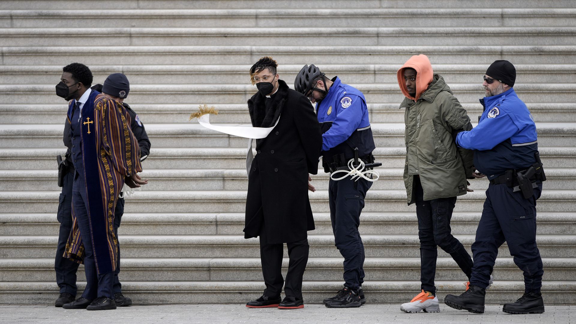 Capitol Police are seen detaining protestors who pushed for voting rights legislation on the U.S. Senate steps.