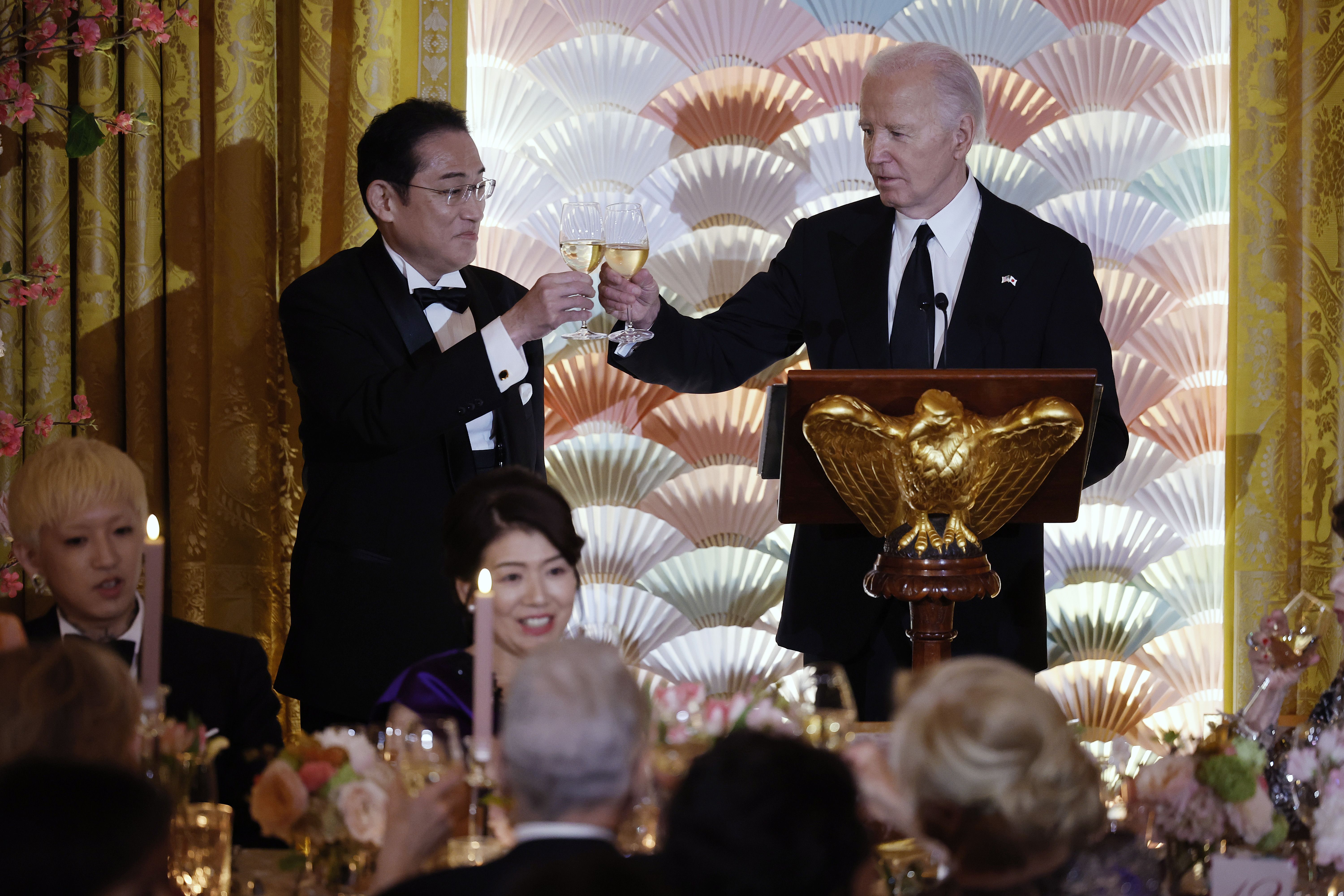 President Joe Biden and Japanese Prime Minister Fumio Kishida toast each other during a state dinner in the East Room of the White House on April 10, 2024 in Washington, DC. Biden welcomed Kishida for an official state visit where the two leaders announced new agreements on technology and strengthening military and economic partnerships against Chinese aggression in the Indo-Pacific region.
