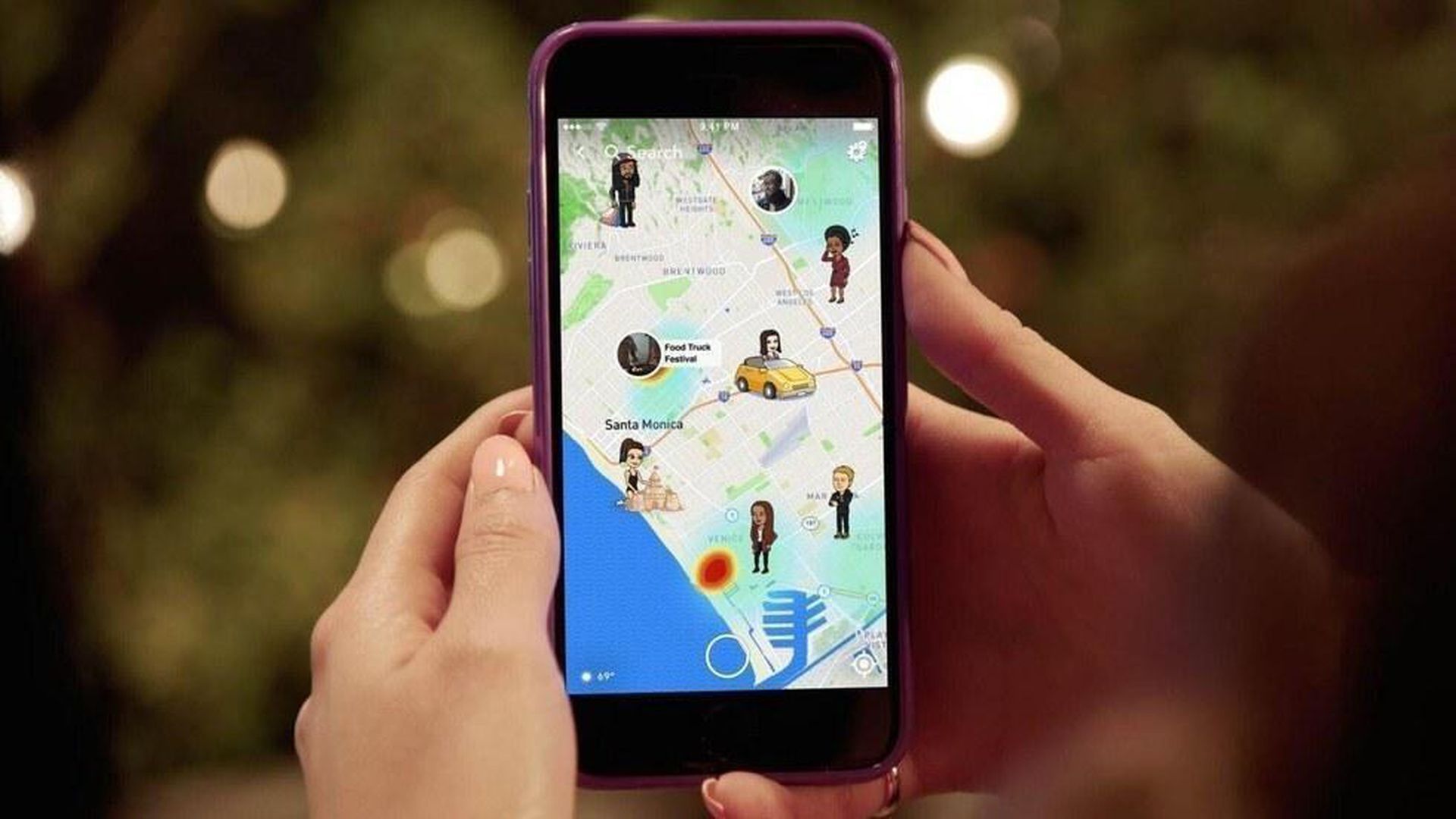 Photo of a phone with Snap Maps, powered by Mapbox