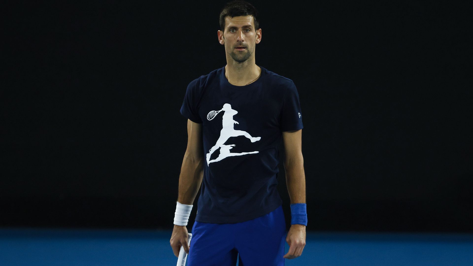 Novak Djokovic of Serbia looks on during a practice session ahead of the 2022 Australian Open at Melbourne Park on January 14, 2022 in Melbourne, Australia.