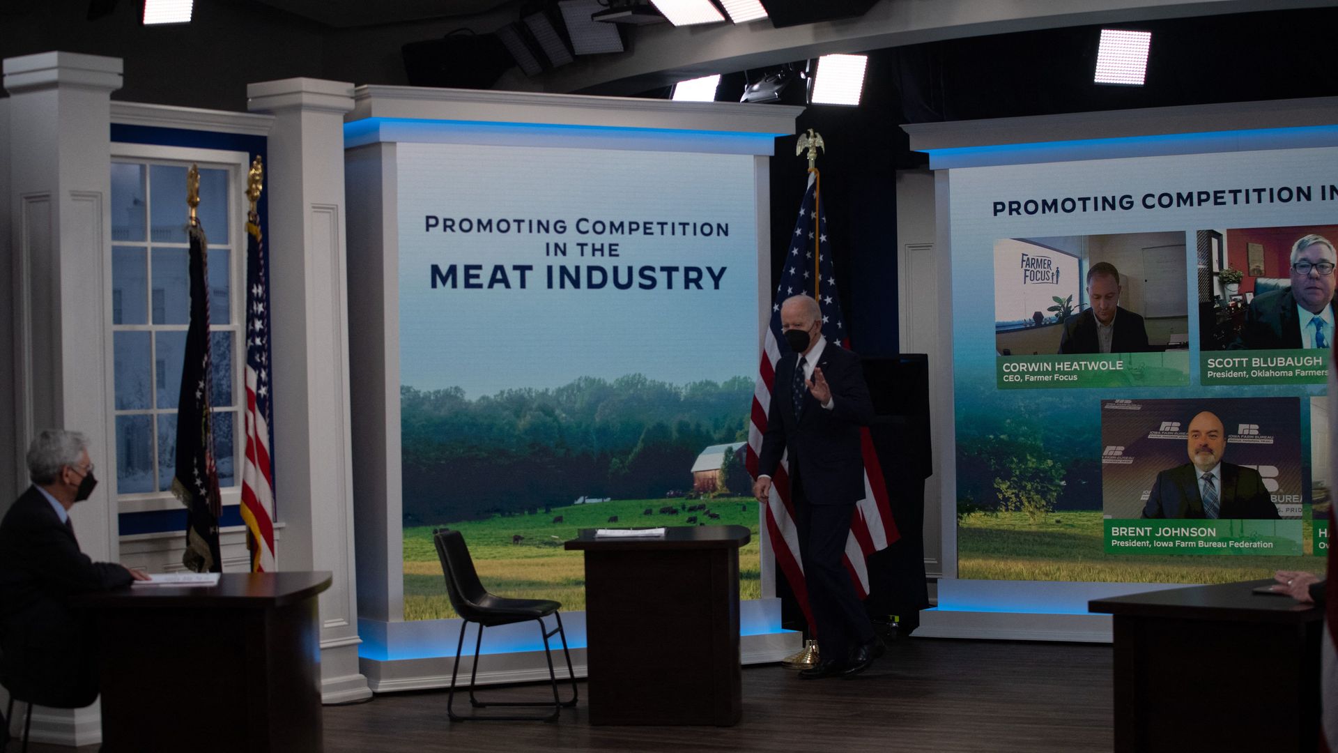 President Biden holds a virtual meeting in front of a colorful depiction of a farm.