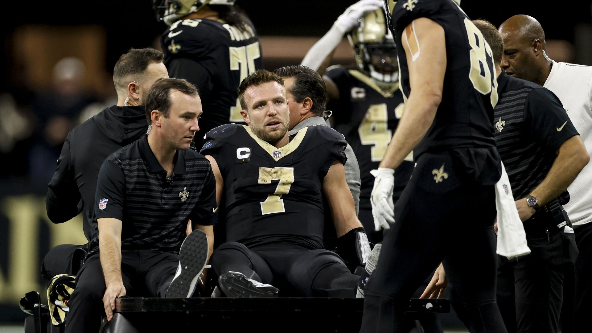 Photo shows Taysom Hill in a Saints uniform on a cart.