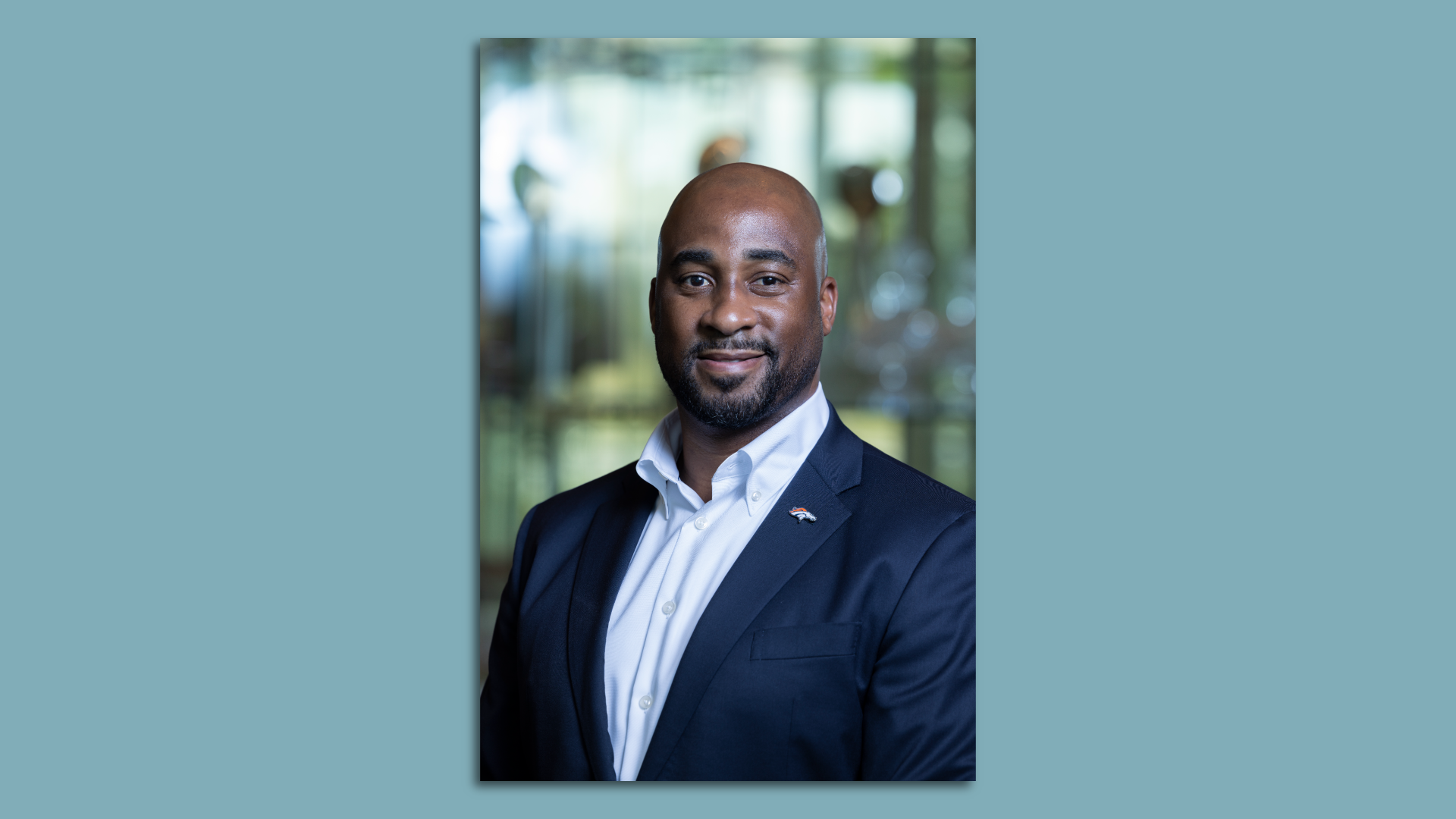 Photo of of a black man in a suit