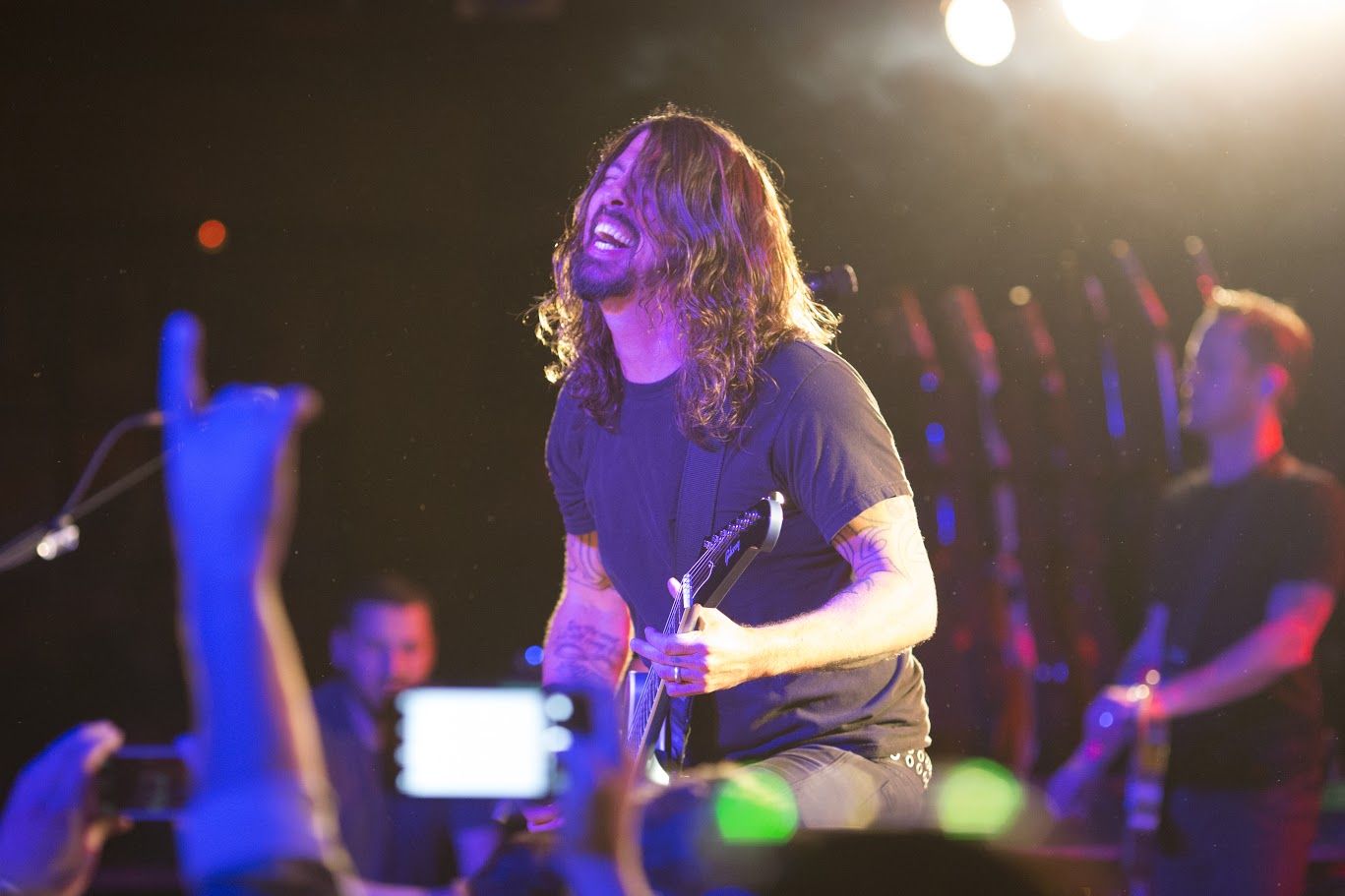 Foo Fighters performs on stage.