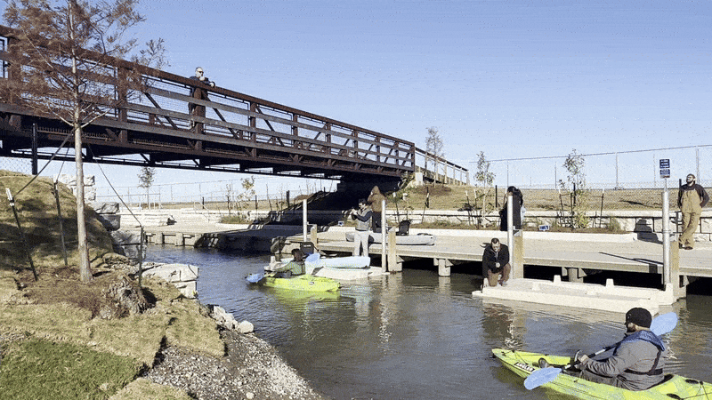 Image shows people kayaking.