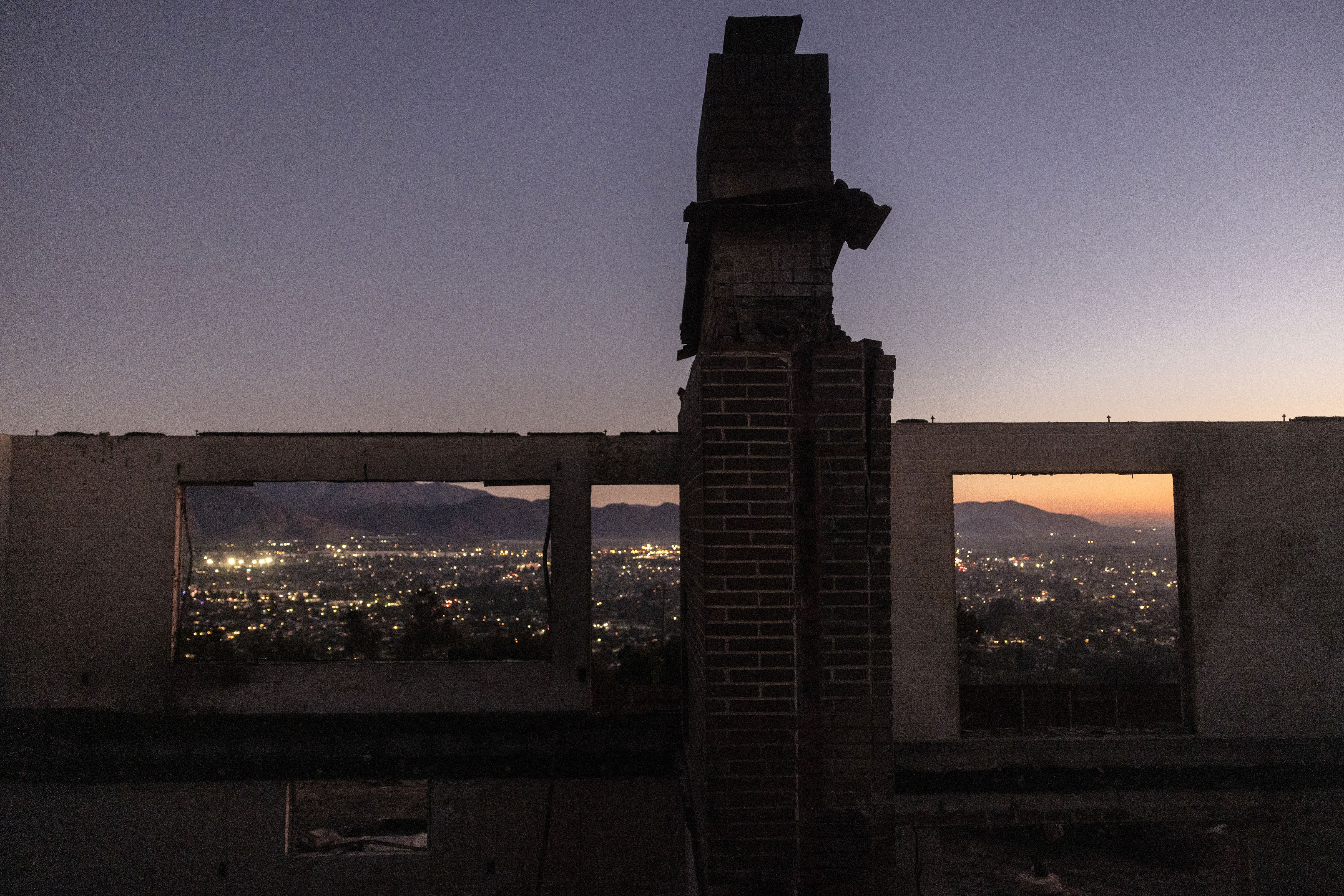 Remains of a house destroyed by the Mountain Fire, fueled by strong Santa Ana winds, are seen in Camarillo, California, on November 7, 2024. 