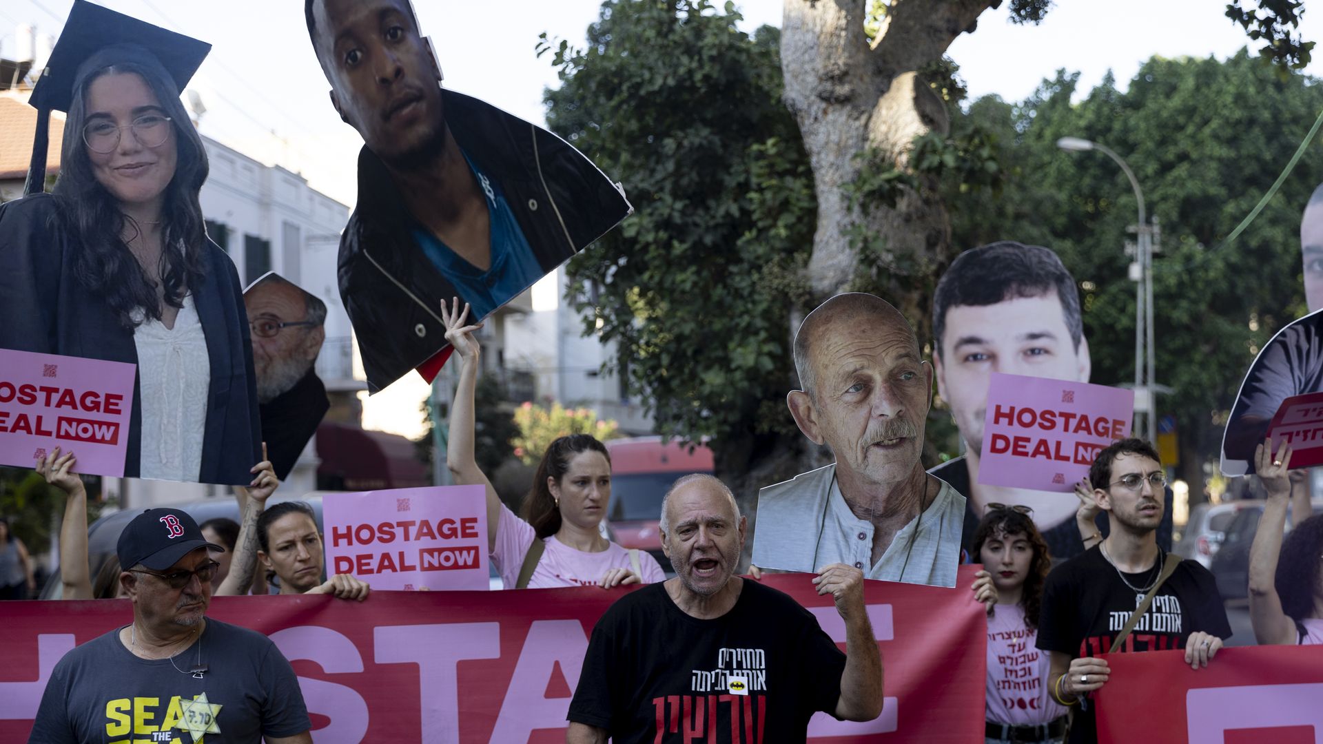 Families of hostages held in the Gaza Strip and supporters hold photos of hostages during a demonstartion calling for a hostage deal on August 15, 2024 in Tel Aviv, Israel.