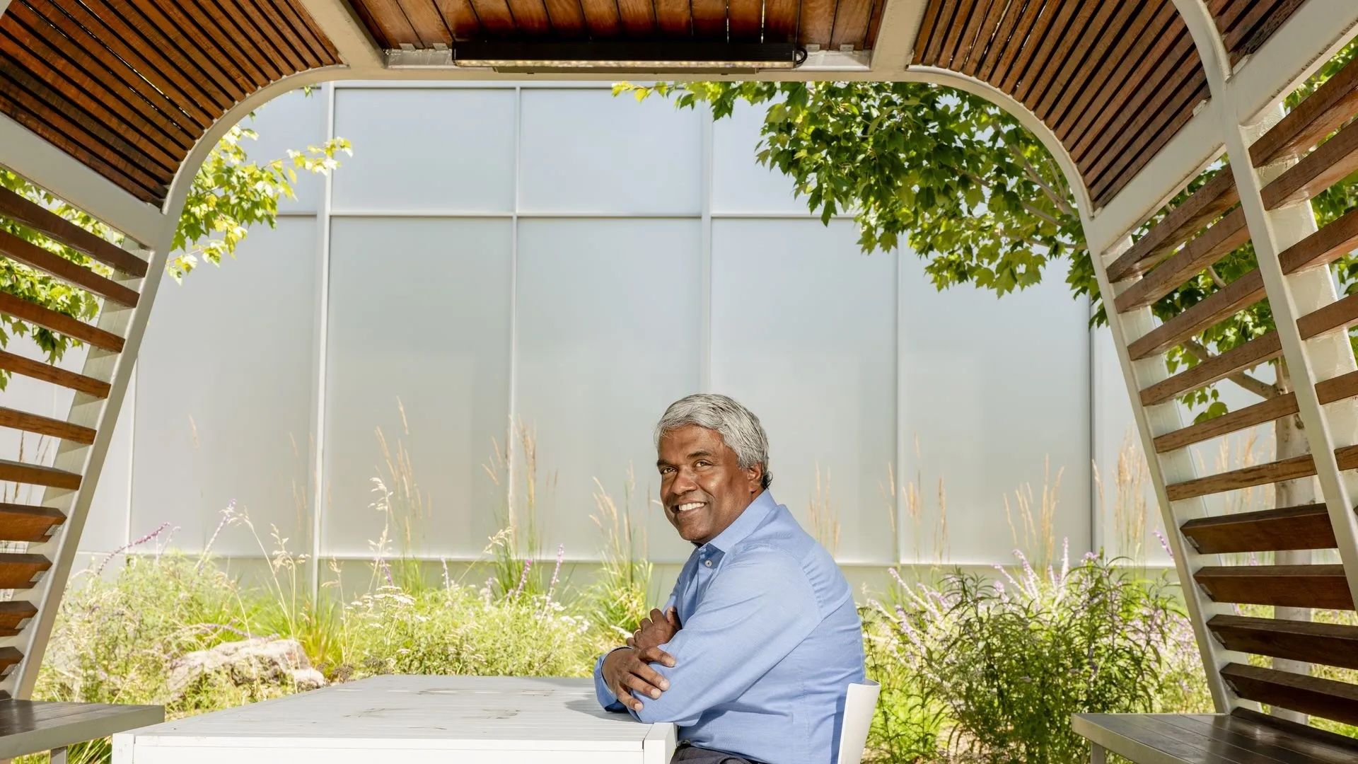 Google's Thomas Kurian sits at a table