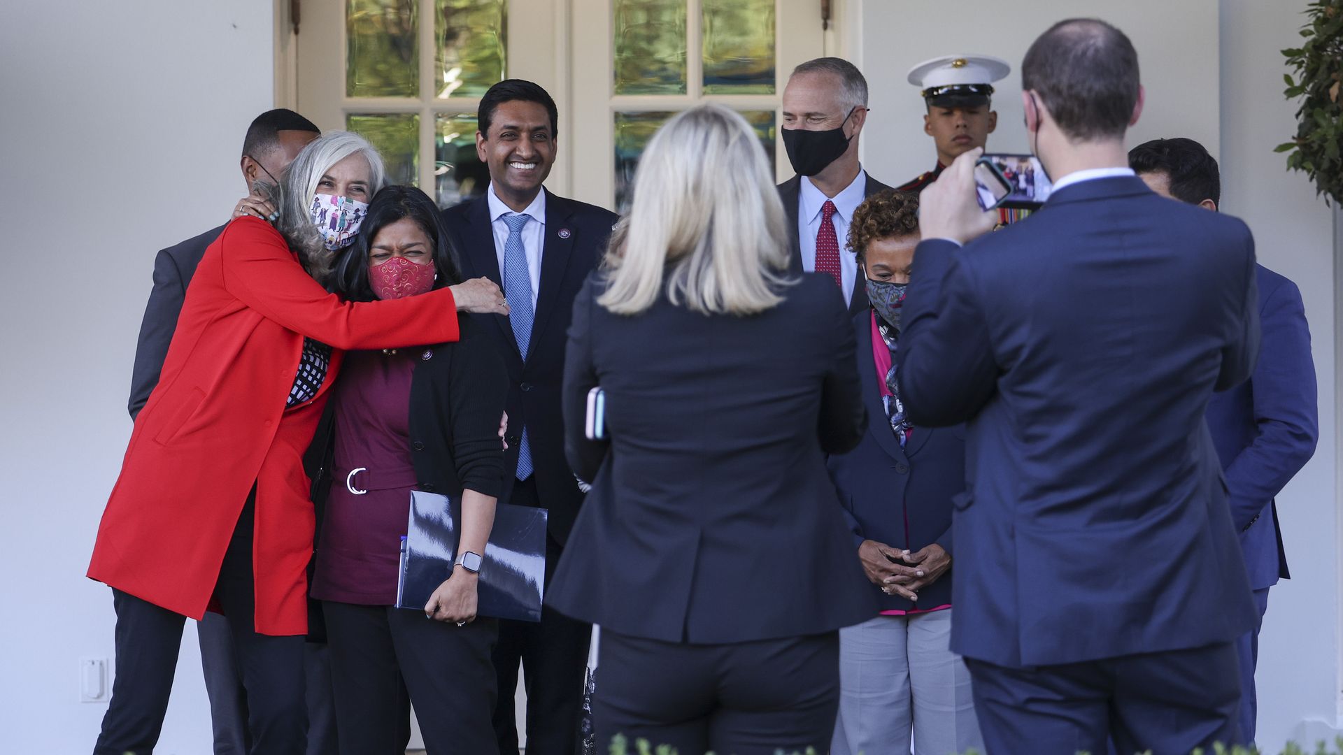 Rep. Katherine Clark is seen hugging Rep. Pramila Jayapal outside the White House.