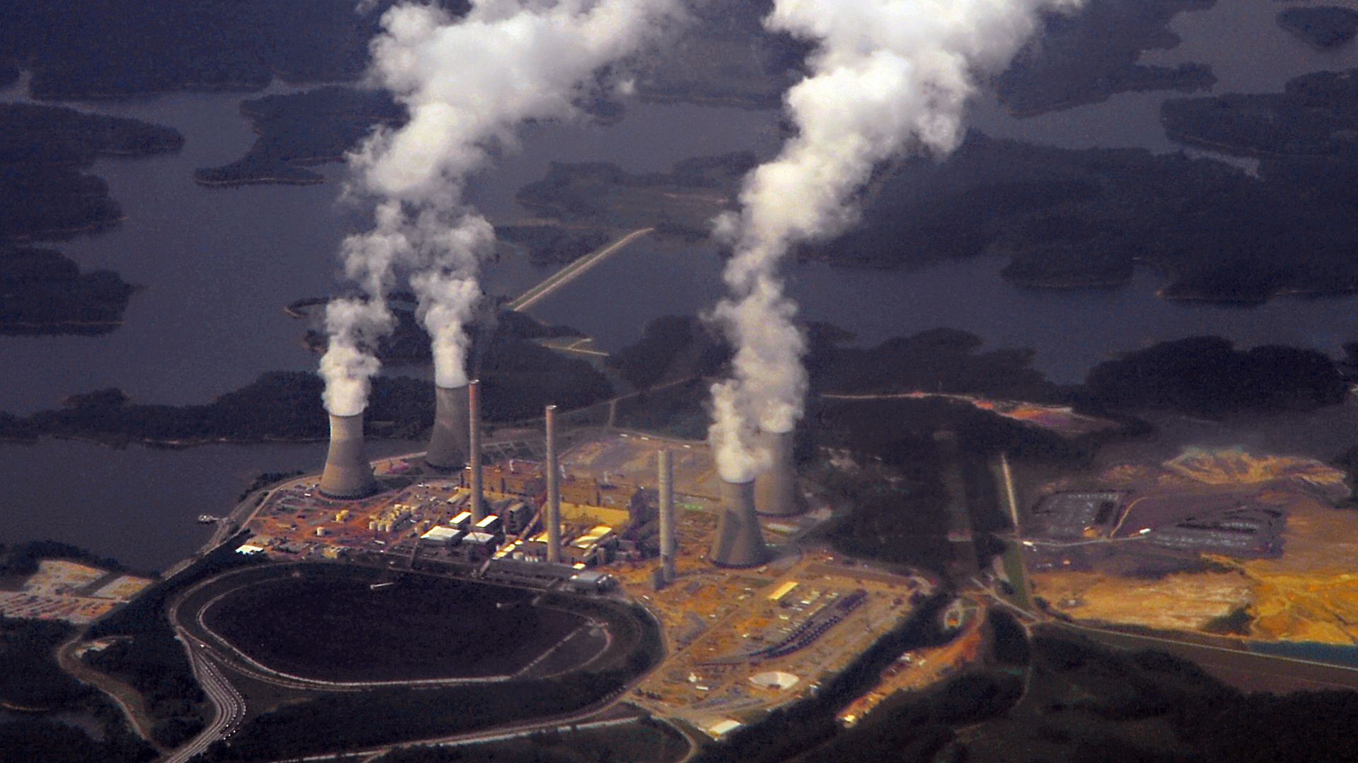 An aerial stock photograph of Plant Bowen, a coal-fired power plant near Cartersville, and a nearby body of water
