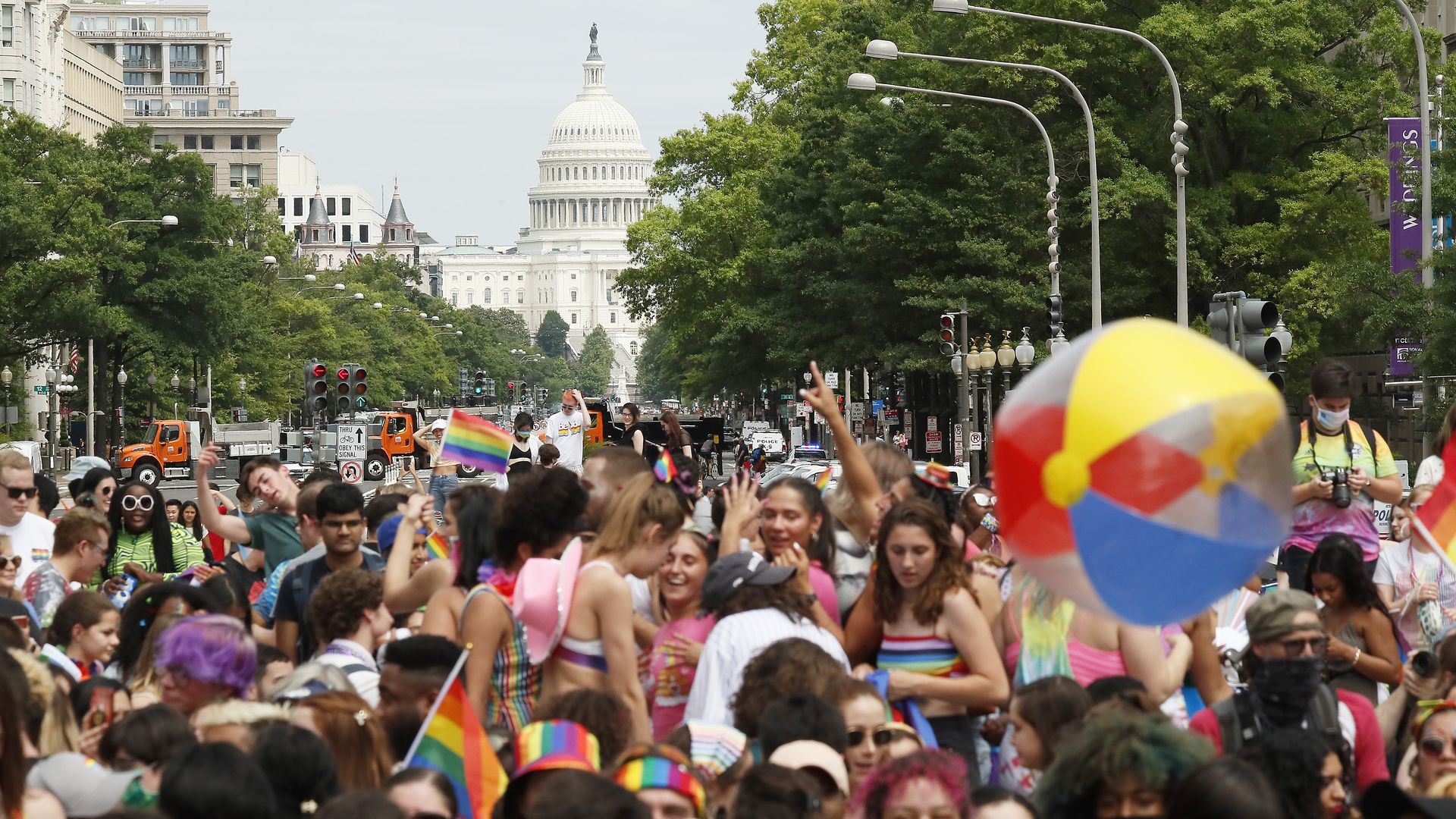 Photo of the U.S. Capitol building and a crowd of people celebrating and dancing in front of it