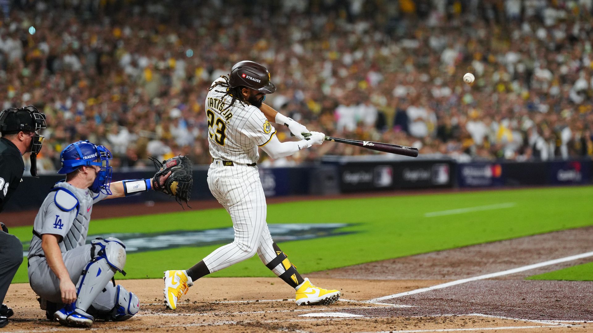 Fernando Tatis Jr. #23 of the San Diego Padres hits a home run against the Dodgers.