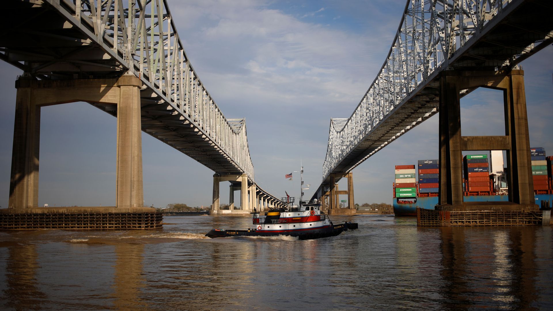 The photo shows a tugboat in the Mississippi River