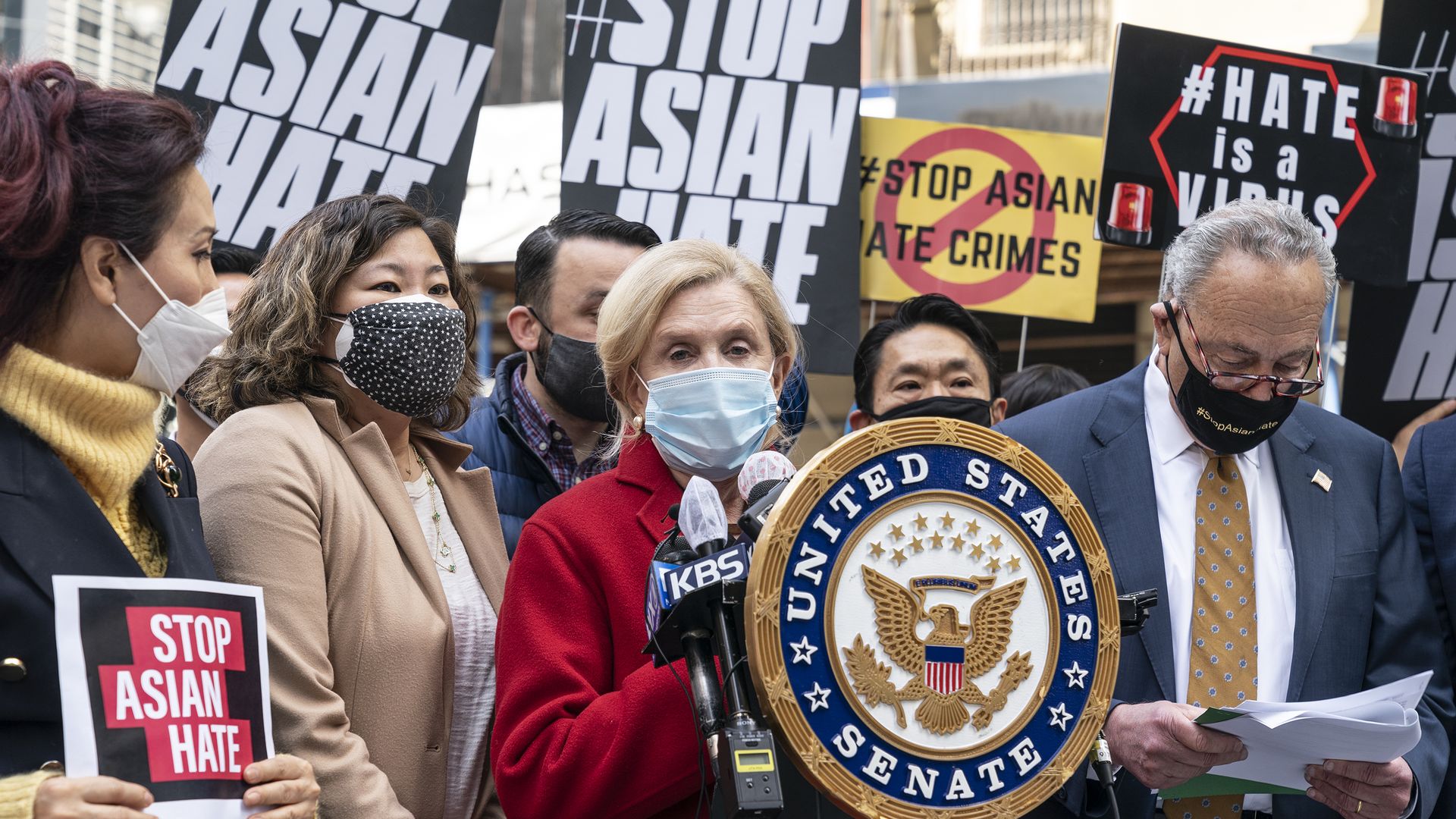 U. S. Representative Carolyn Maloney speaks at the rally. To her right is U. S. Representative Grace Meng. To her left Senate Majority Leader Charles Schumer.