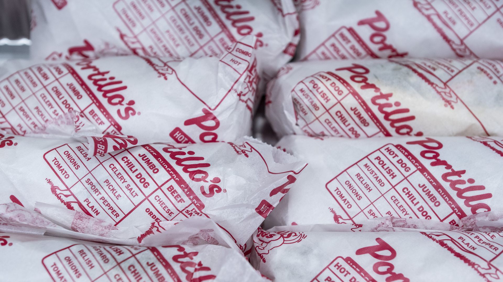 Portillo's white and red chili dog packaging consumes the screen.
