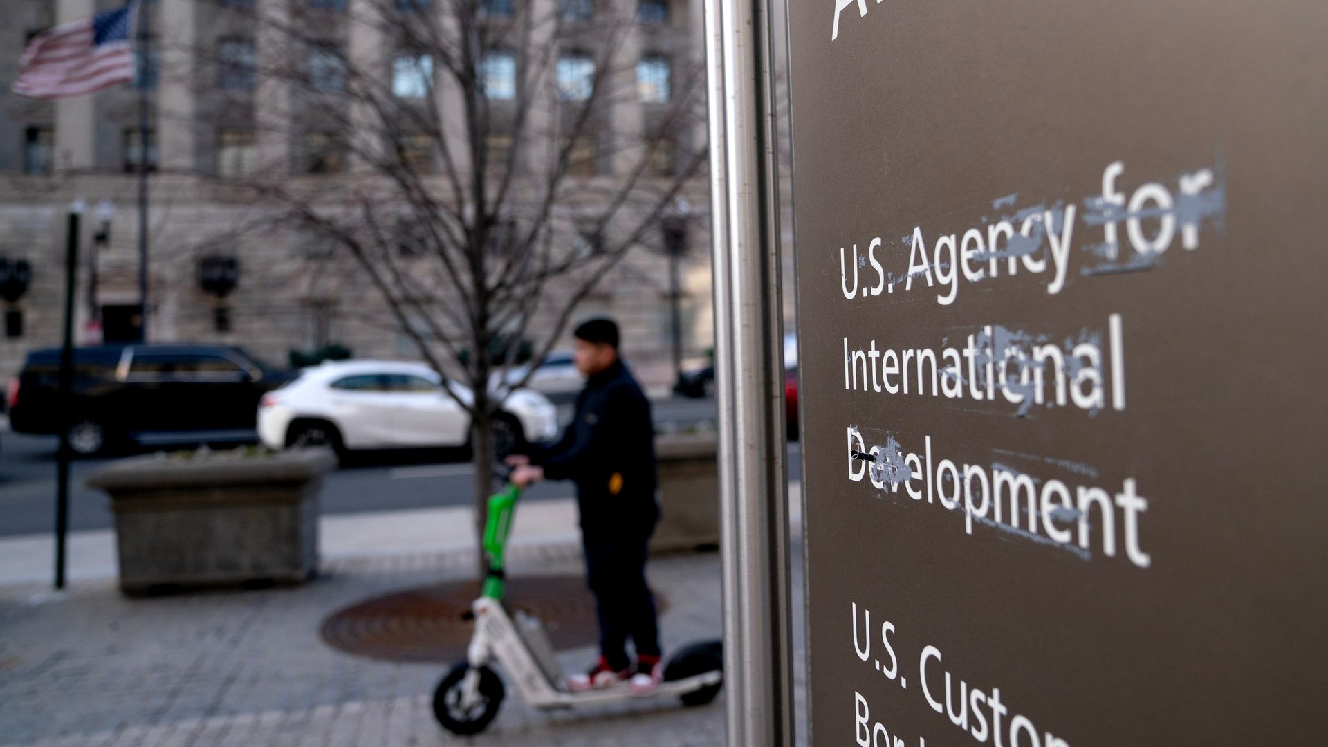 Damaged signage at the US Agency for International Development (USAID) headquarters in Washington, DC, US, on Sunday, Feb. 9, 2025. A federal judge said he would pause the Trump administration's plans to place 2,200 US Agency for International Development workers on leave, an attorney for the worker