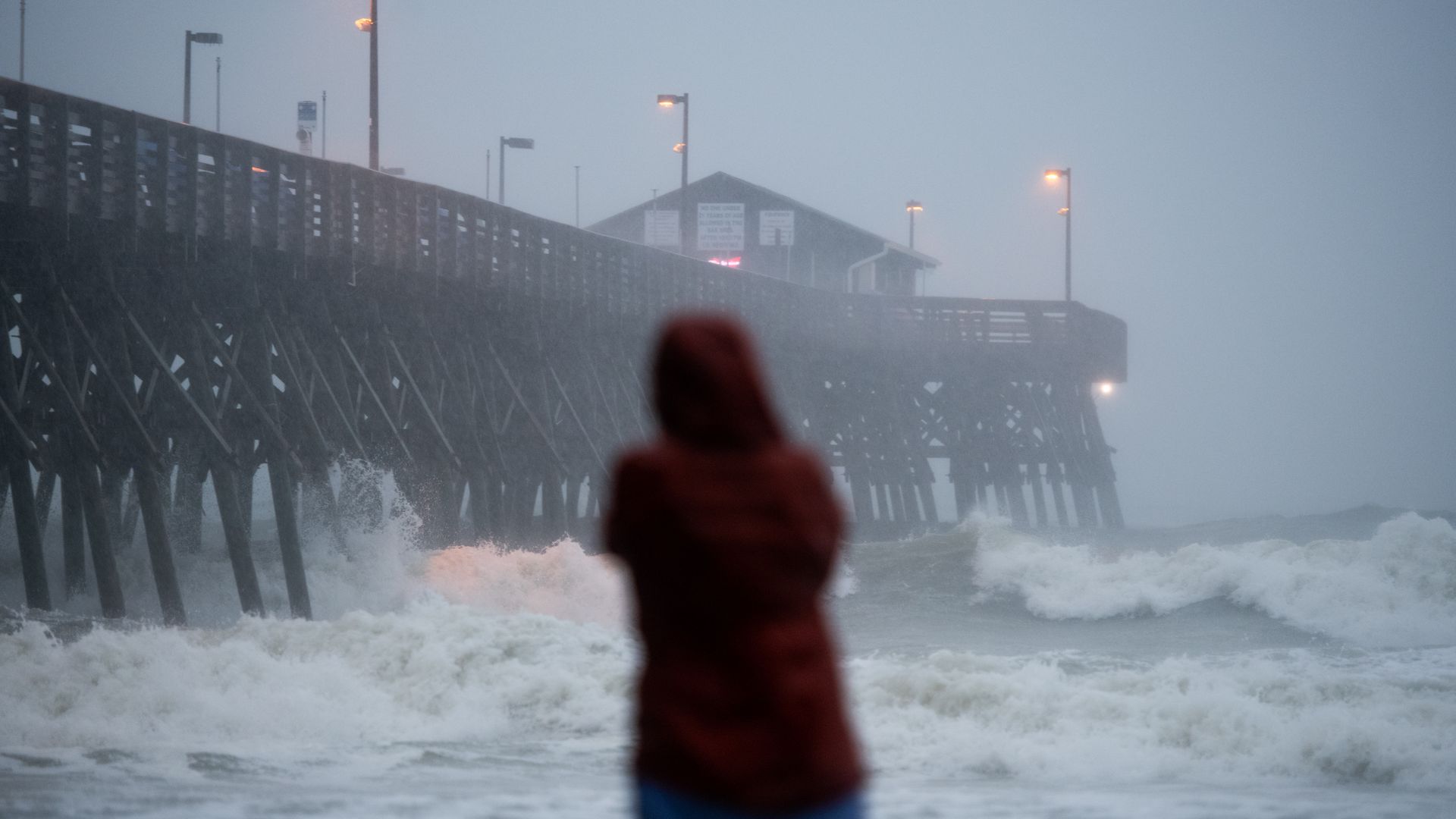 A person watching a hurricane.