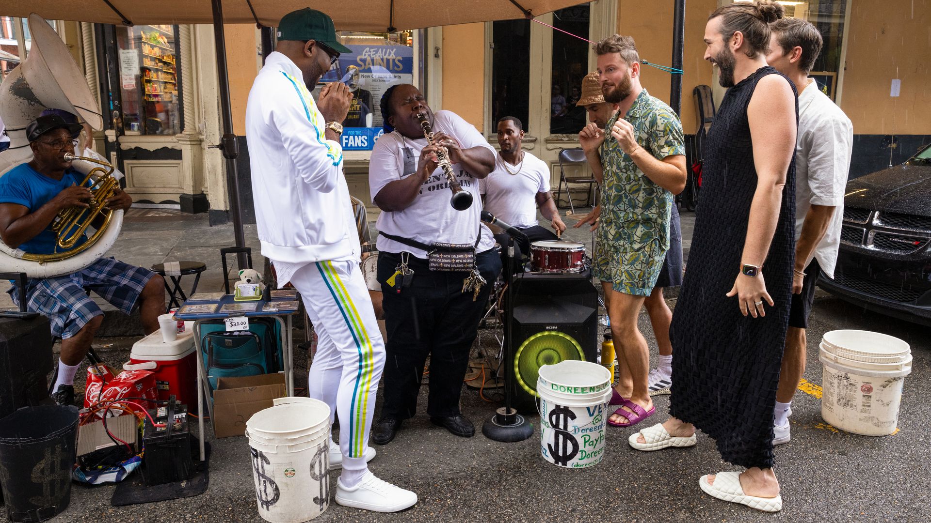 The Fab Five stand around Doreen Ketchens on Royal Street as she plays her clarinet.