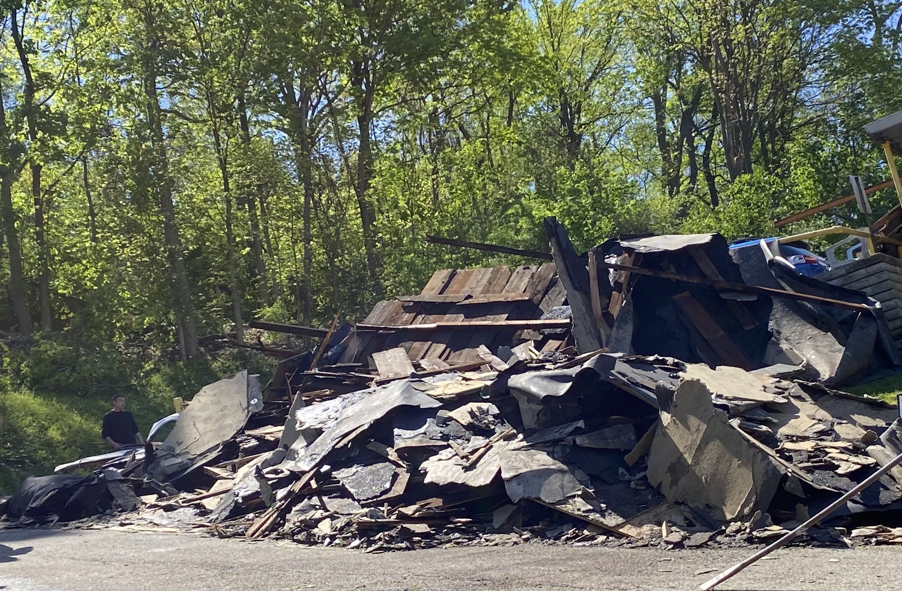 Debris from a roof that was ripped from a pizza shop.