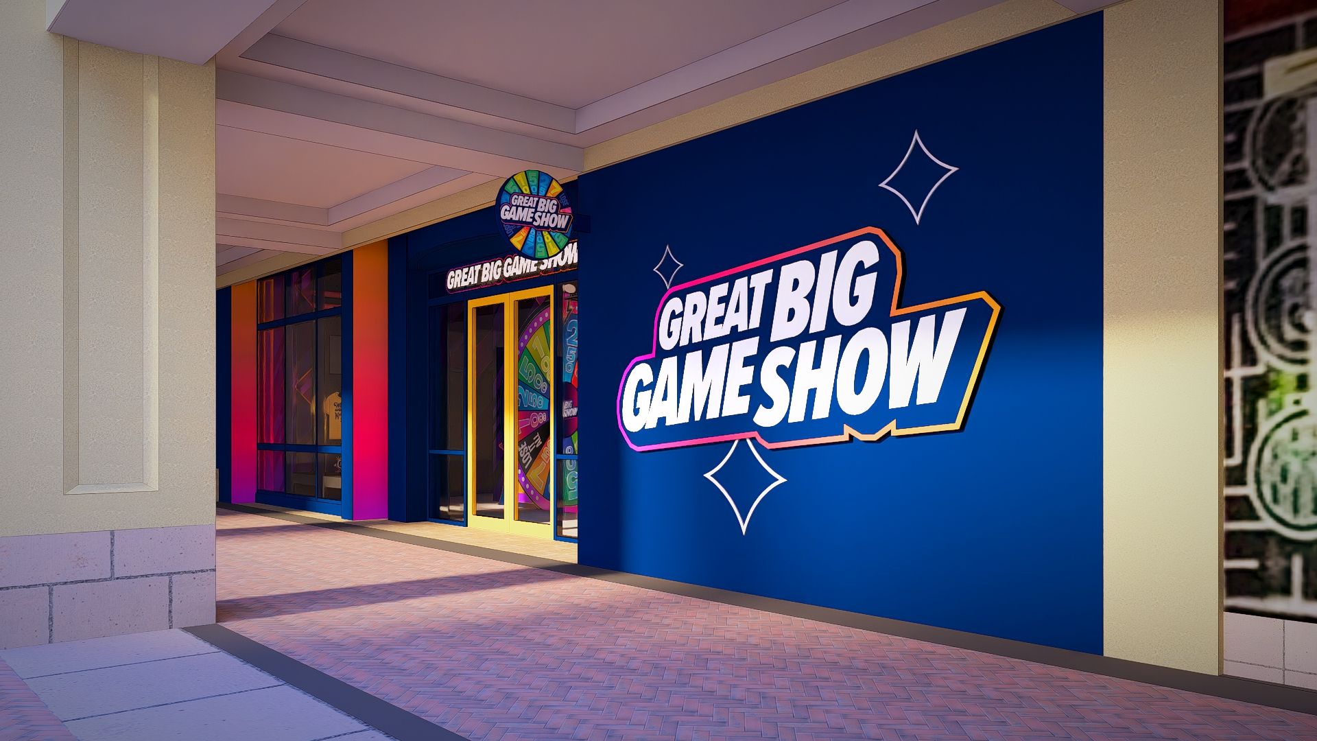 Colorful storefront with a large blue wall displaying "GREAT BIG GAME SHOW" in bold white letters outlined in pink and orange; white diamond accents, a circular sign above the door, and glass doors with yellow frames.