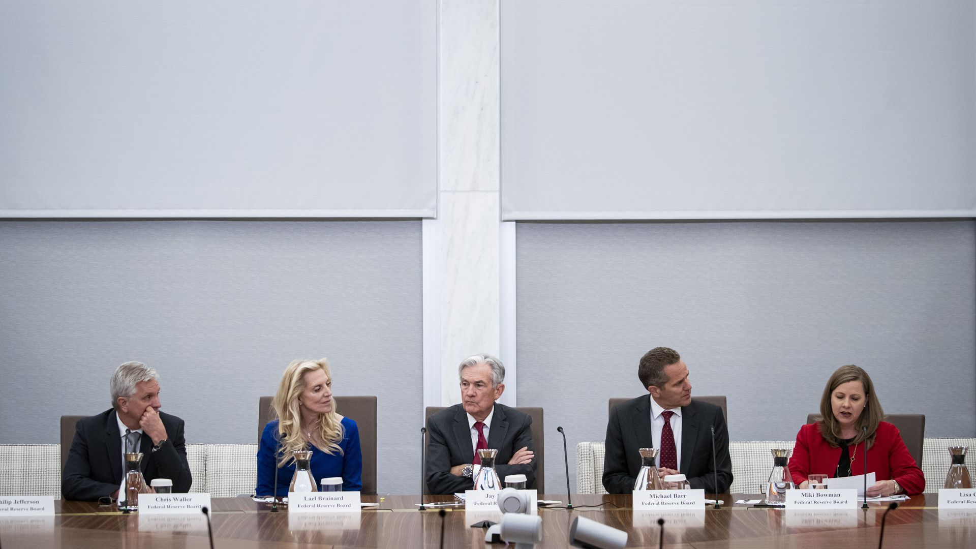 Image of five Fed leaders attending a meeting