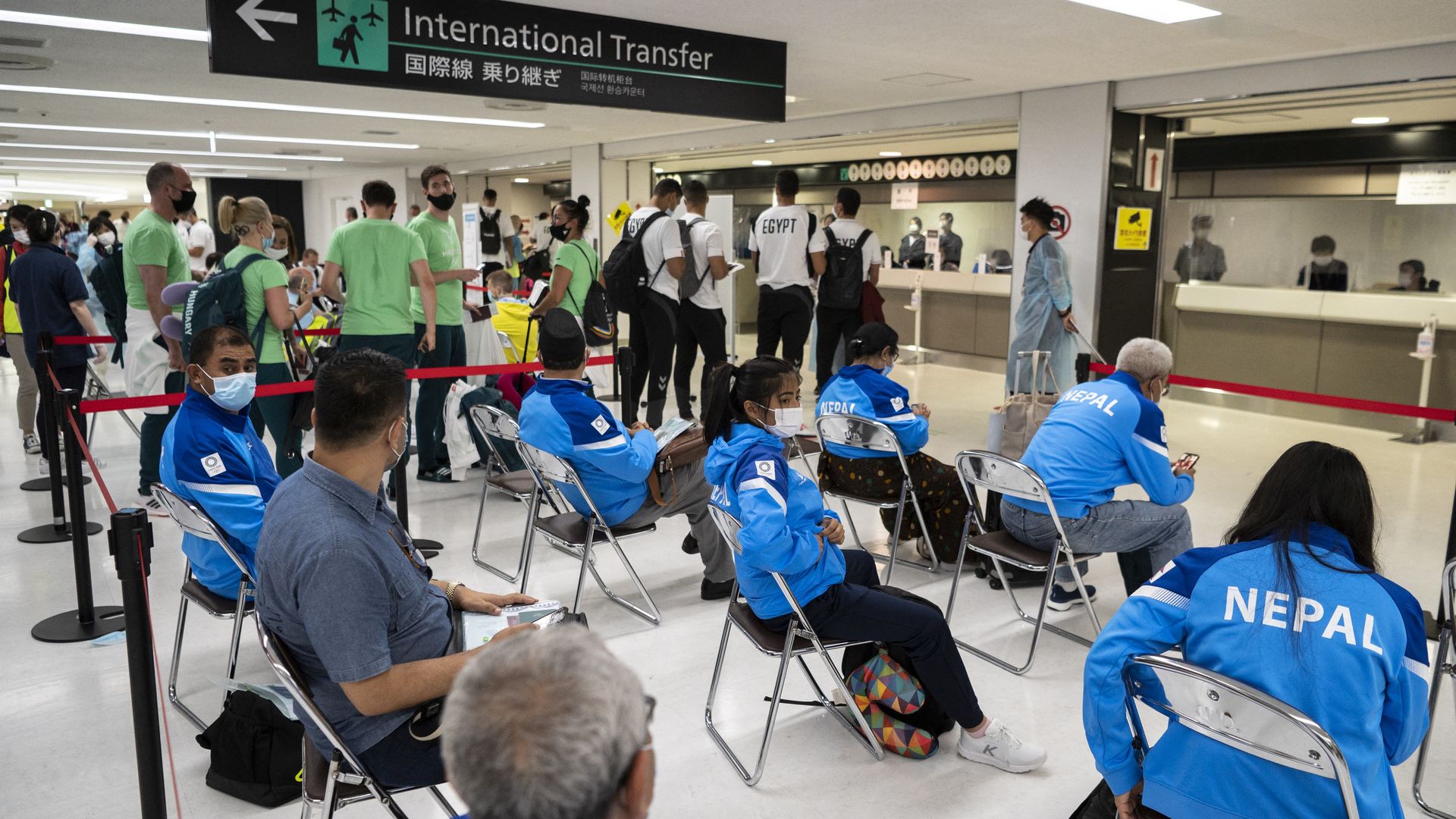 The members of different delegations wait for their Covid-19 test results after arriving for the Tokyo 2020 Olympic Games at Narita International Airport in Narita, Chiba prefecture.
