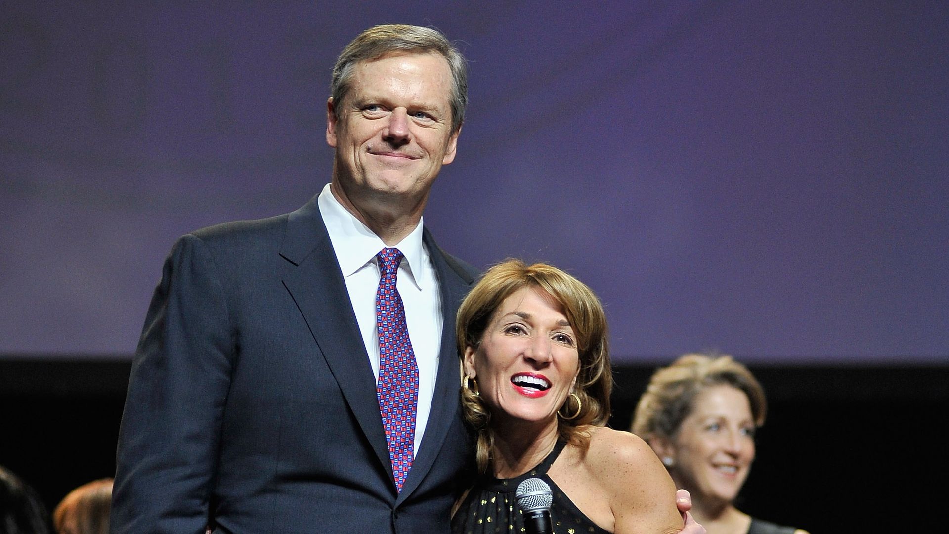 Massachusetts Gov. Charlie Baker is seen embracing Lt. Gov. Karyn Polito at their 2016 inaugural.