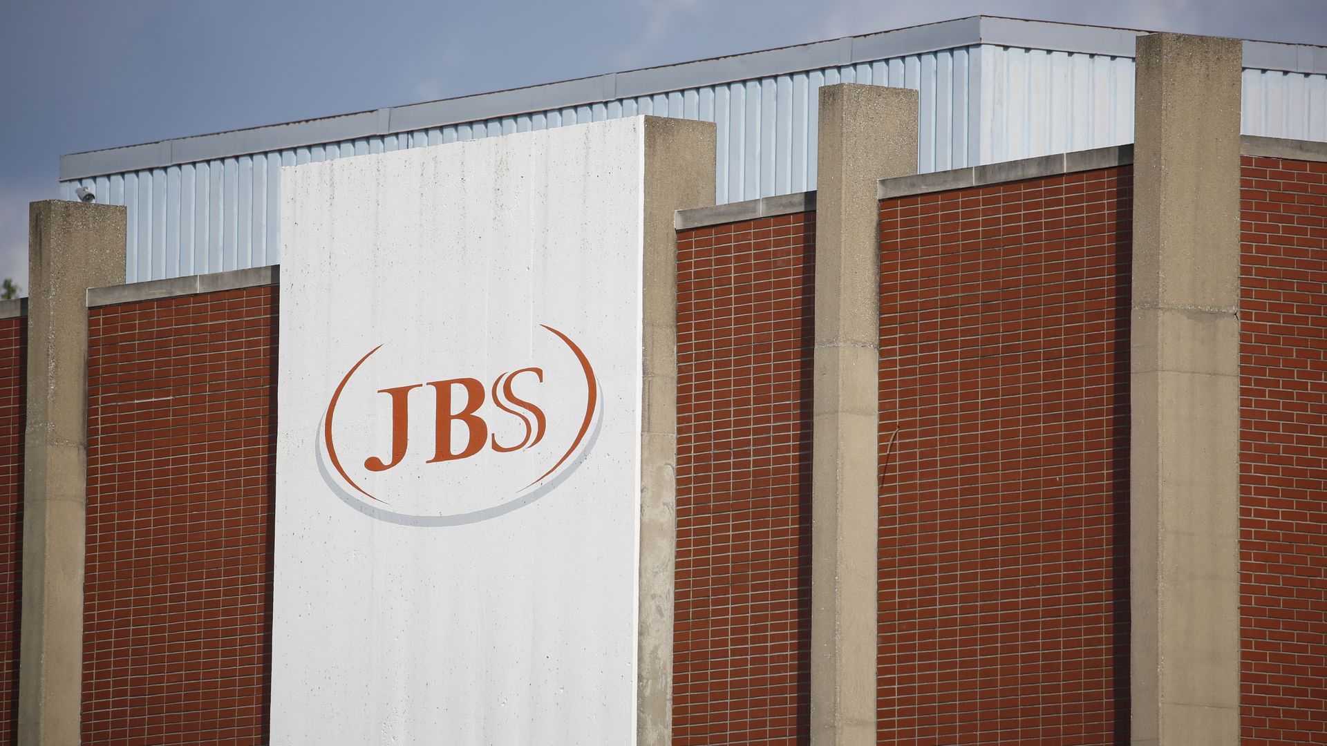 Signage is displayed outside the JBS SA pork processing plant.