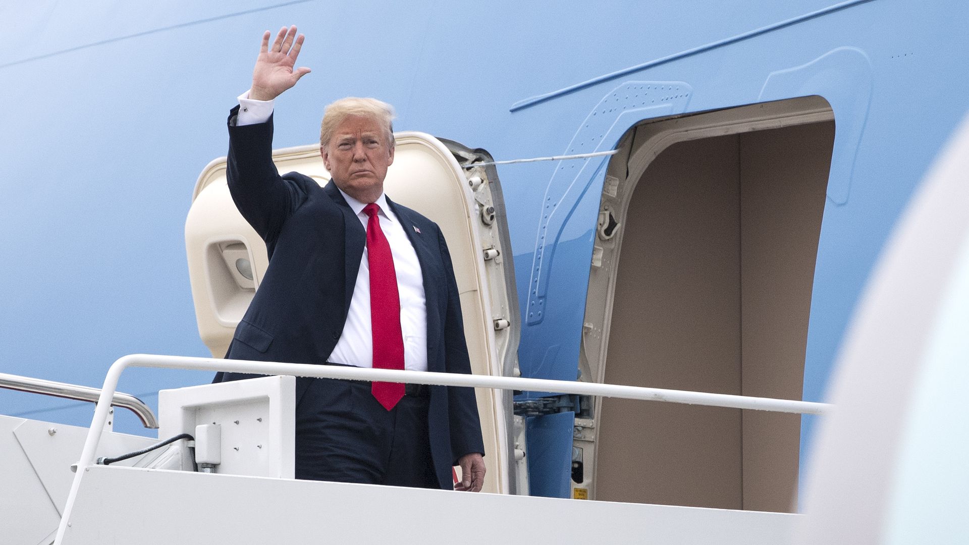 Donald Trump waving before boarding Air Force One