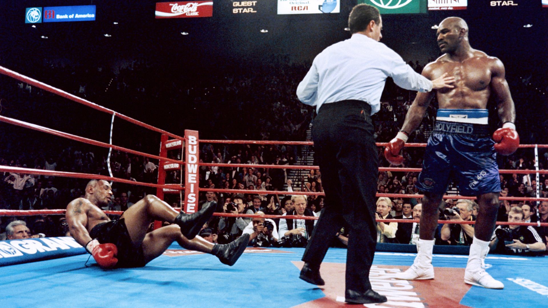 Evander Holyfield knocks down Mike Tyson