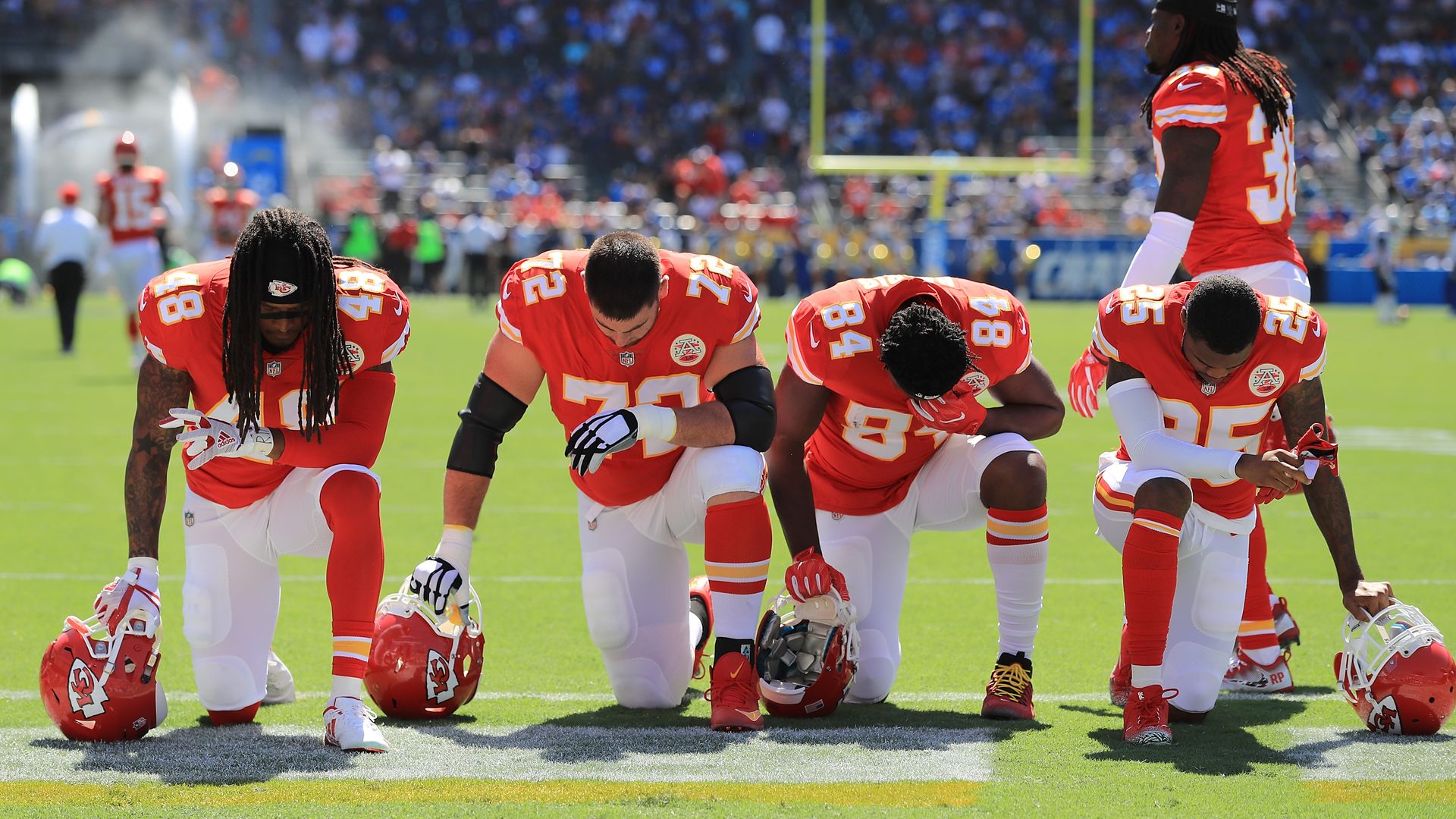NFL players kneeling