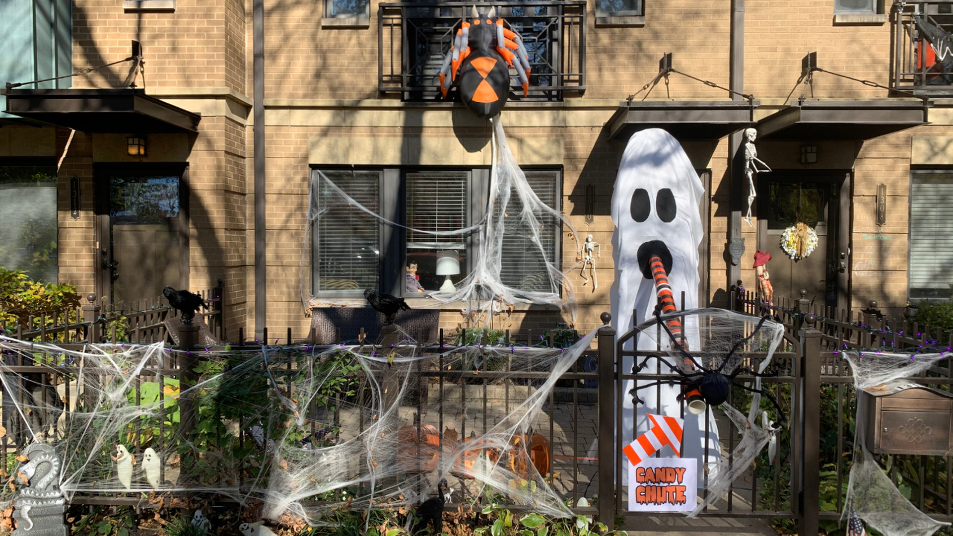 A candy chute is set up outside a home. 