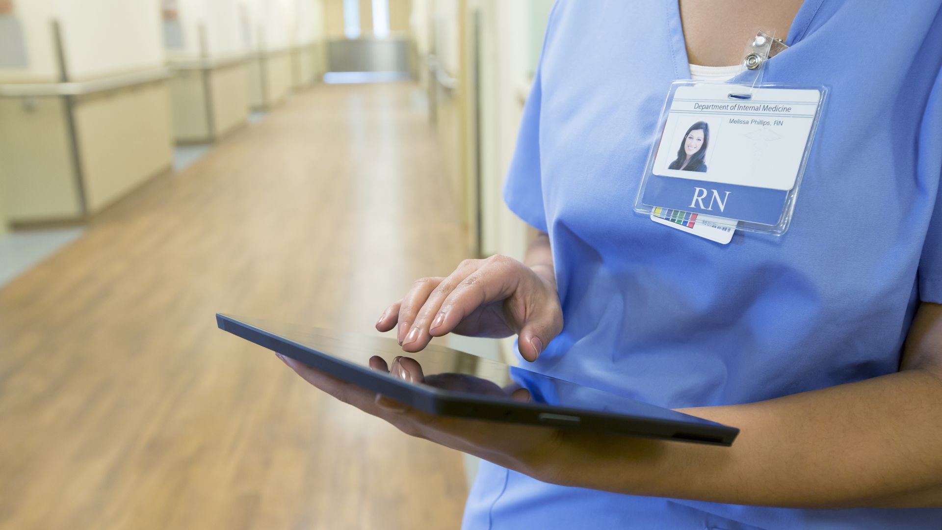 Nurse using tablet device