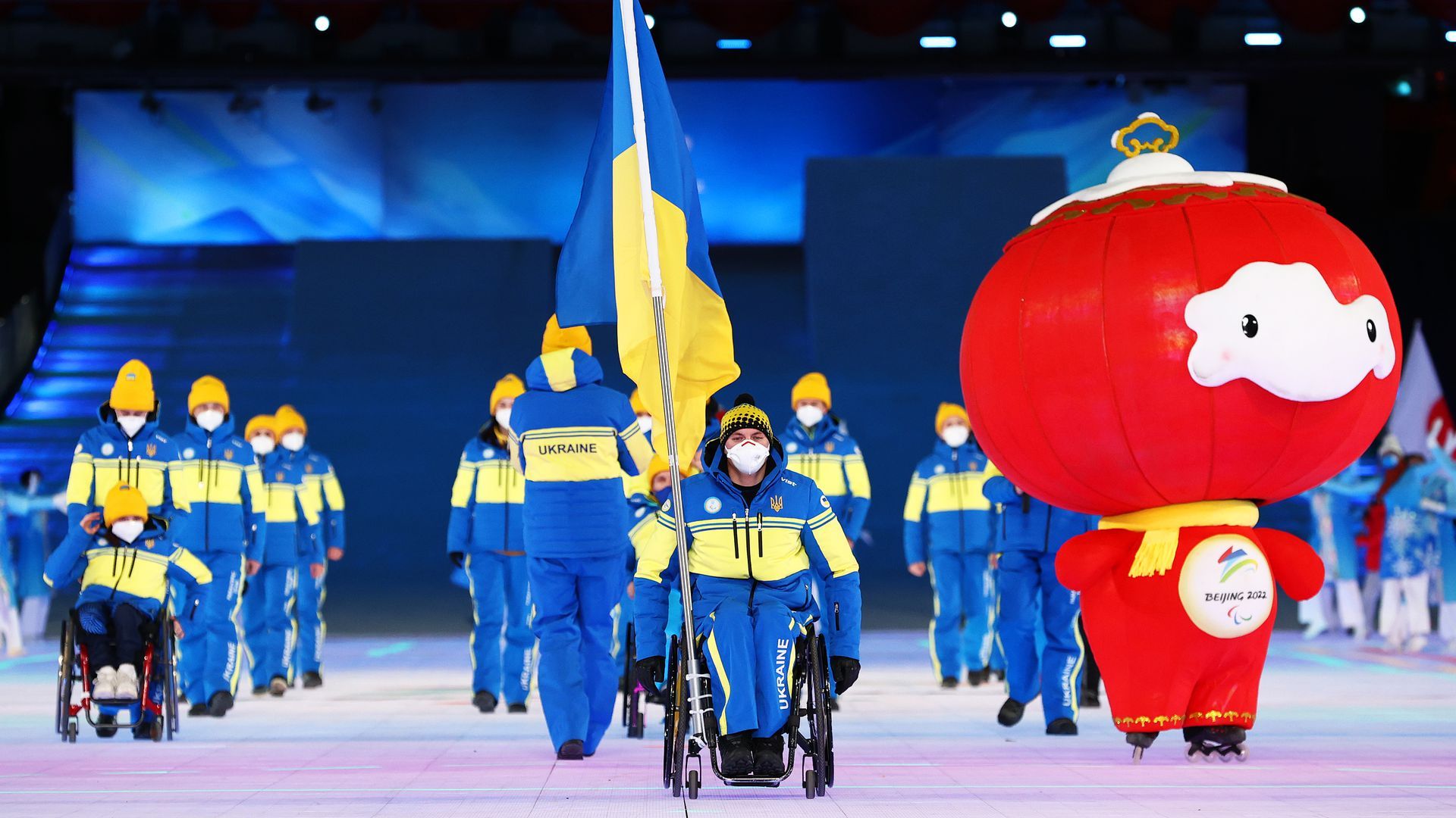 Flag bearer Maksym Yarovyi and Team Ukraine during the Opening Ceremony