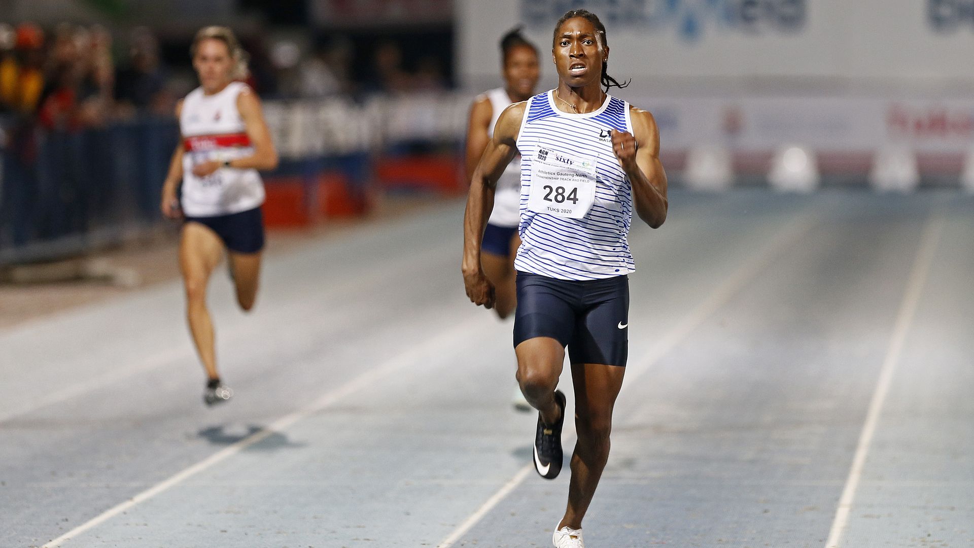 Caster Semenya runs ahead of other women in a race