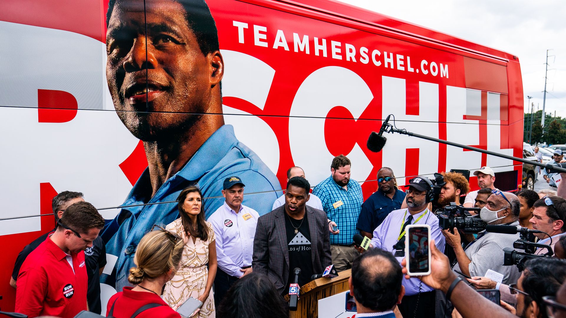 Herschel Walker speaks to a press gaggle