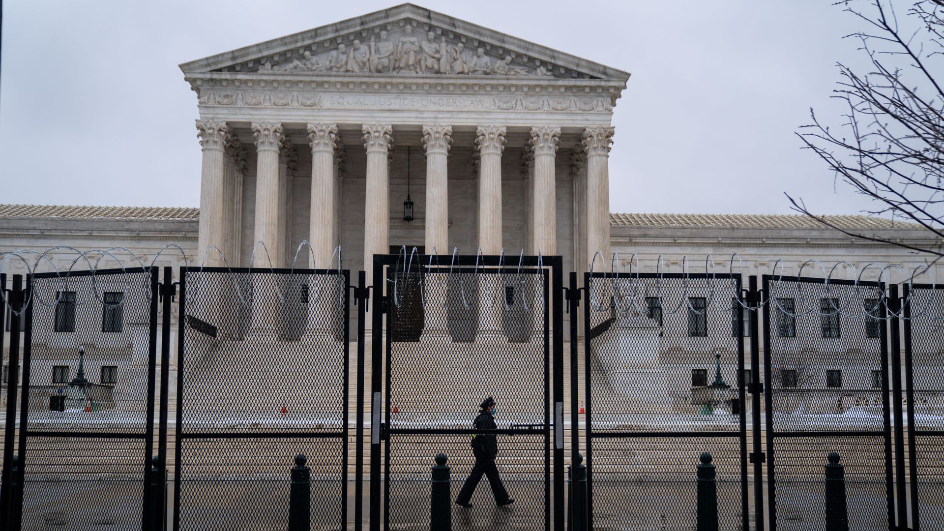 A person walking outside of the Supreme Court building on Feb. 22.