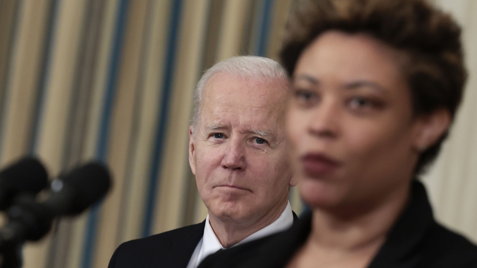 President Biden is seen looking on as OMB Director Shalanda Young speaks about his FY2023 budget.