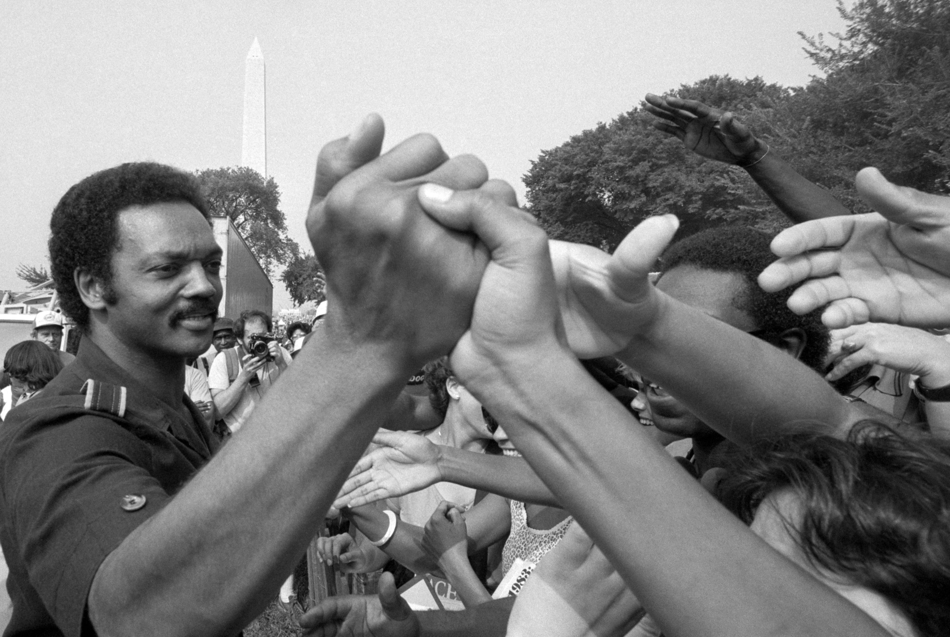 Rev. Jesse Jackson shakes hands at the 20th anniversary commemoration of the Martin Luther King, Jr.'s Freedom March, also known as the "March on Washington".